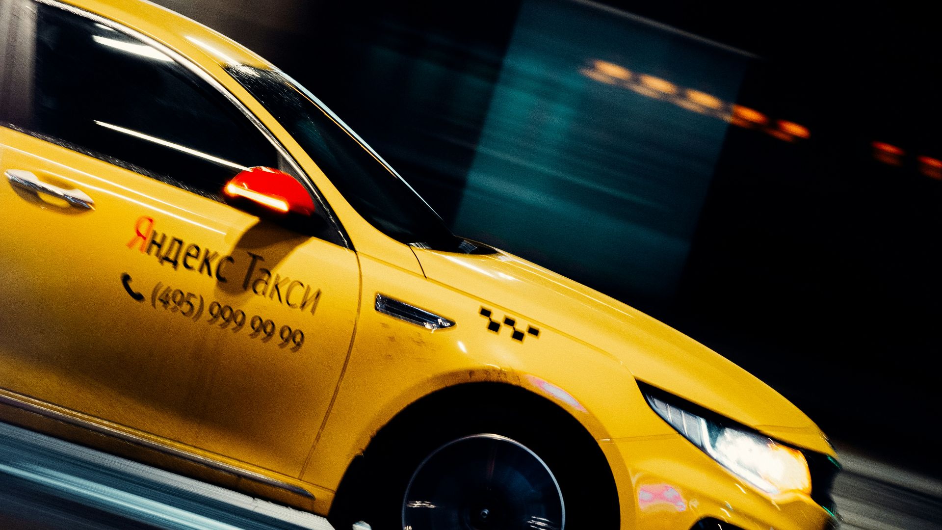 yellow taxi cab on road during night time