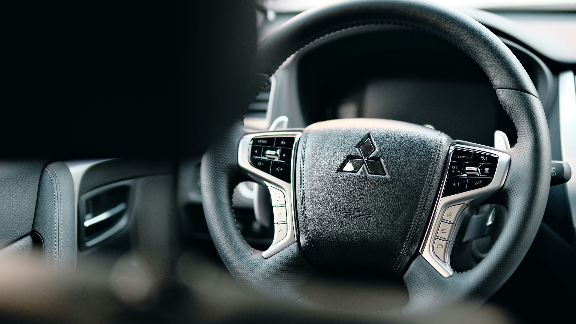 black honda steering wheel in close up photography