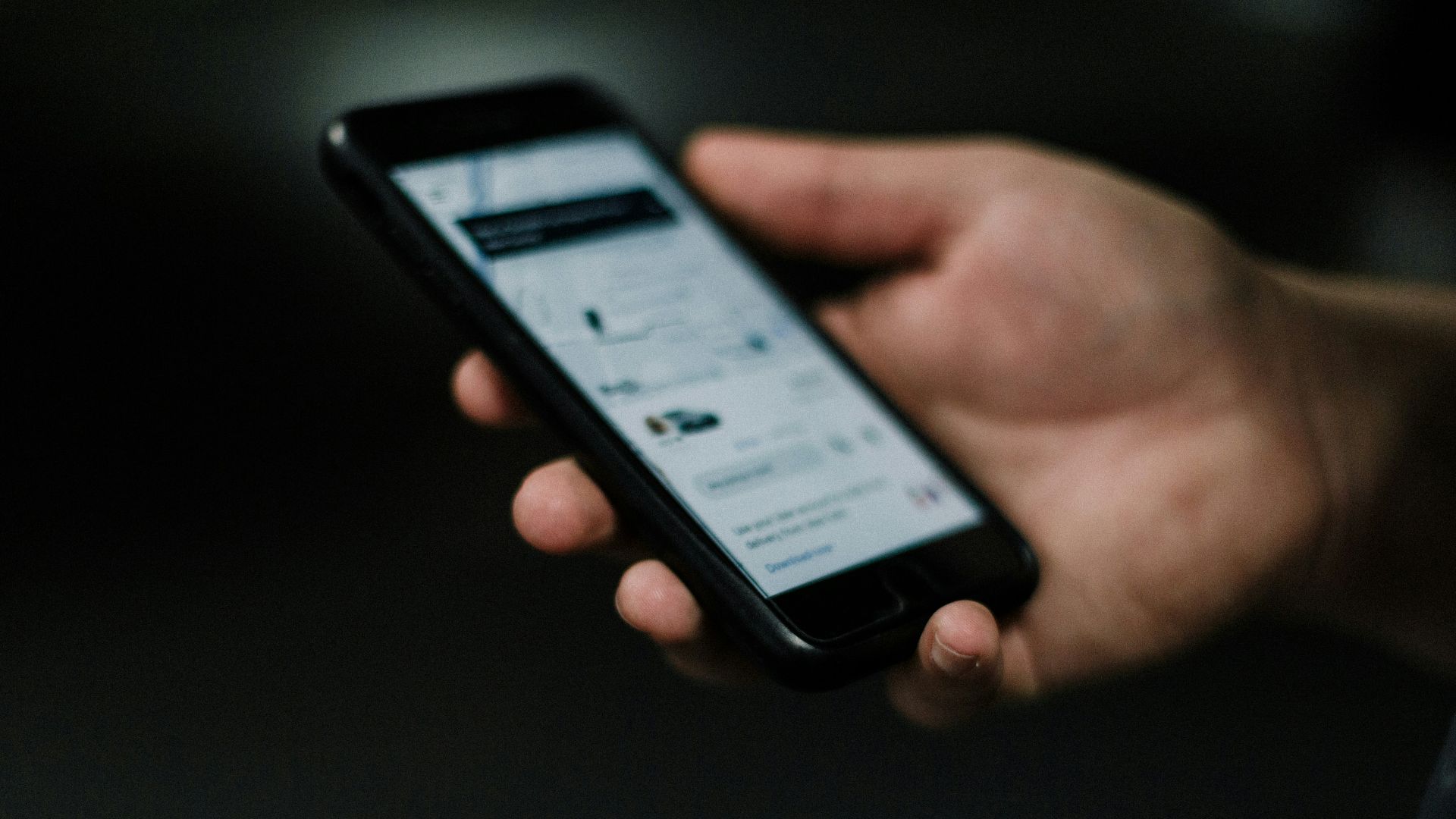 person holding black iphone 5