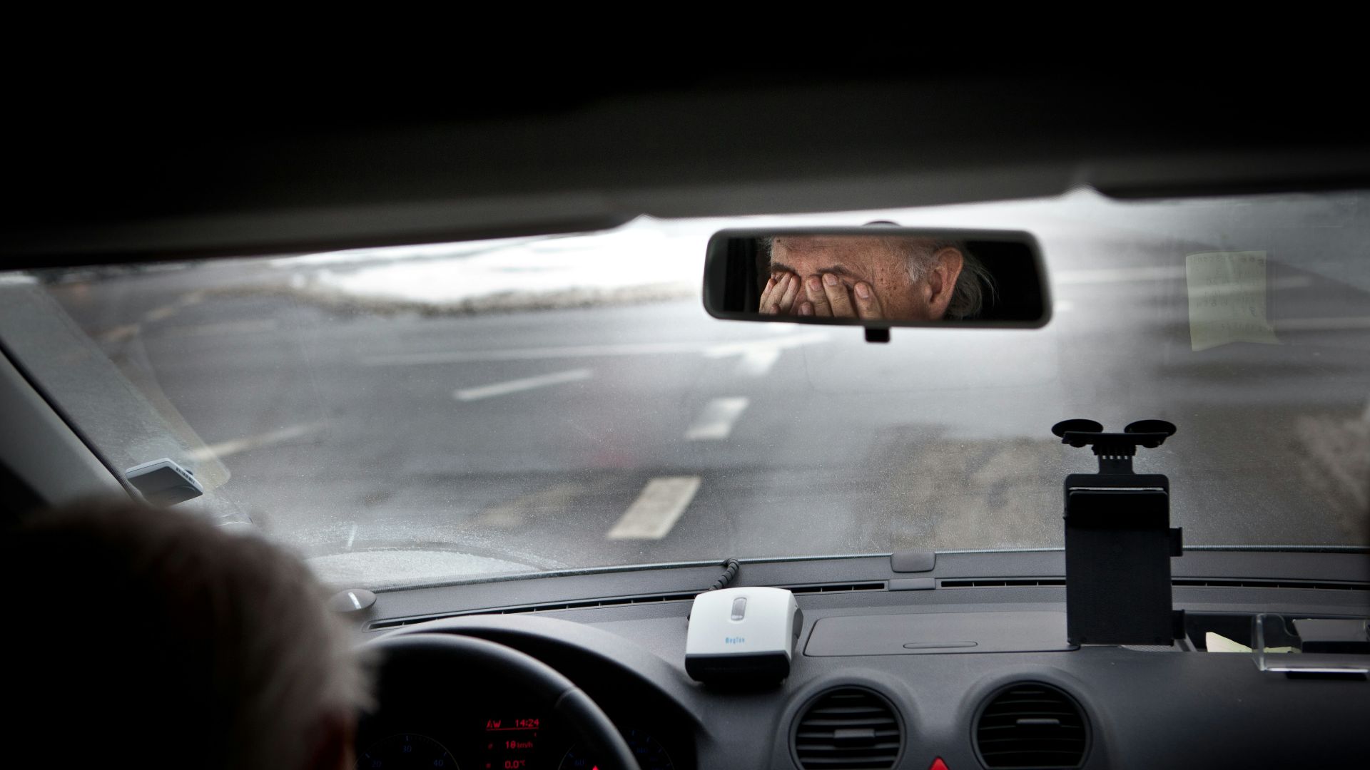 person driving car during daytime