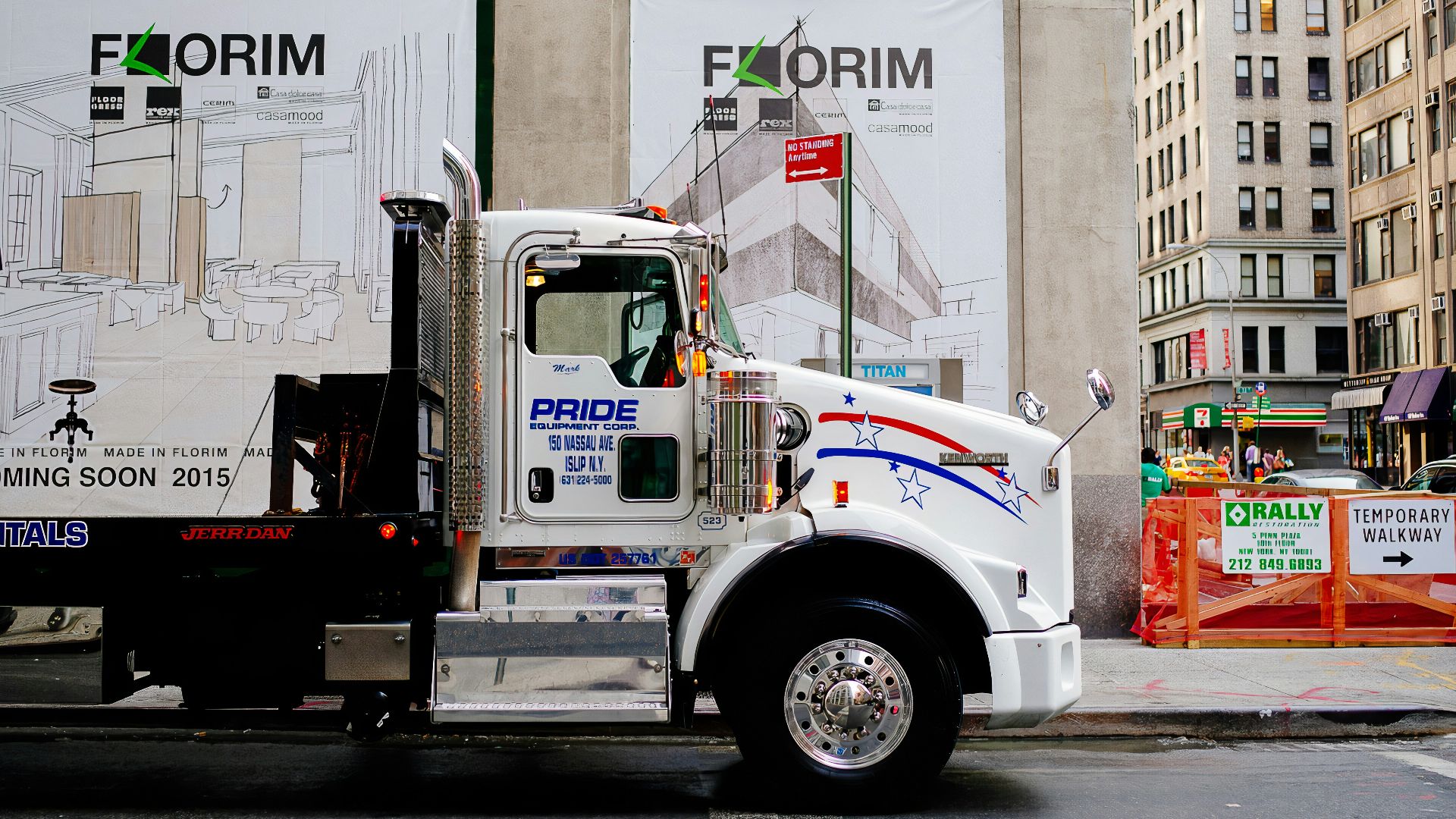 white and blue truck on road during daytime