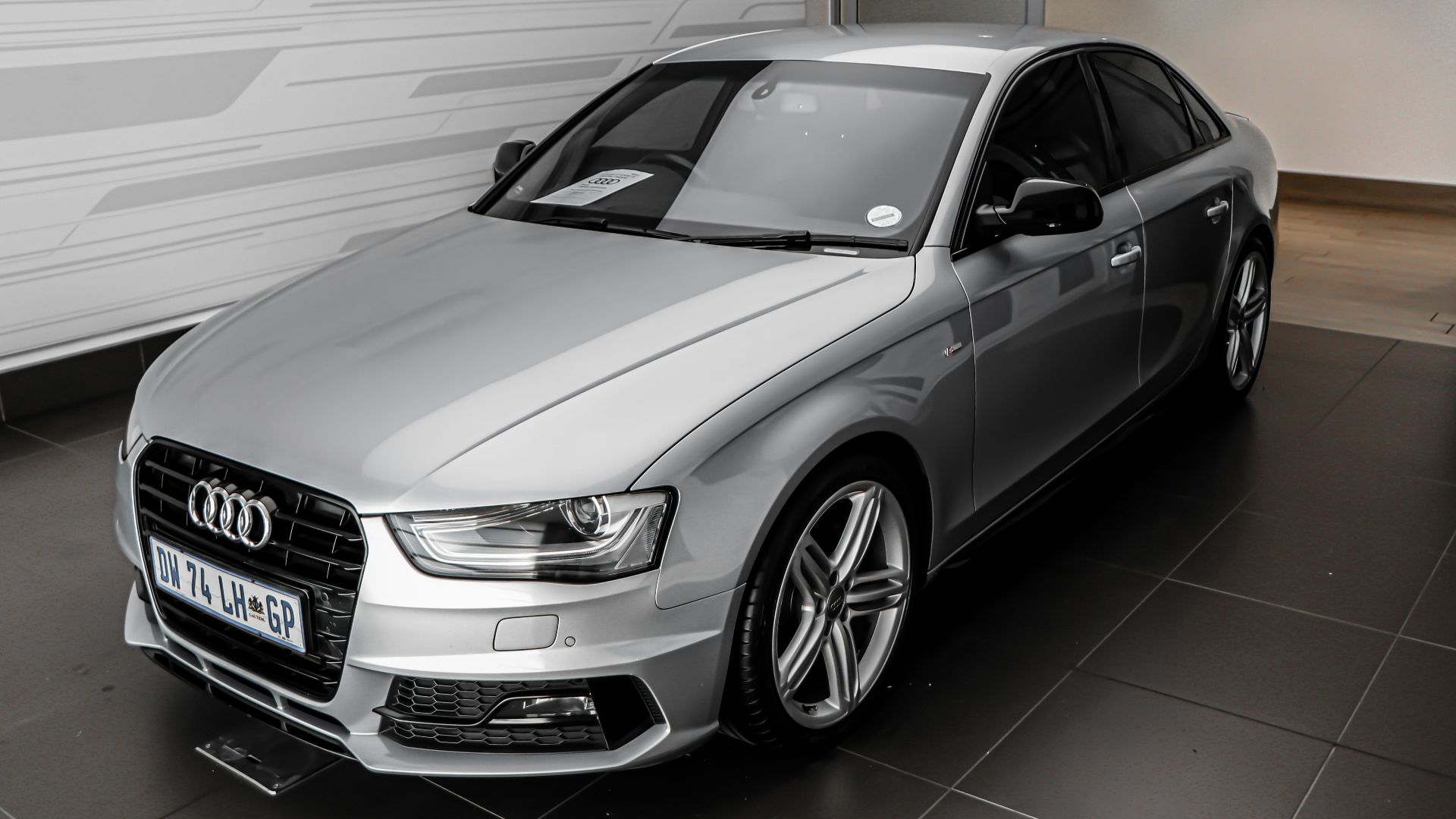 silver mercedes benz coupe parked in garage
