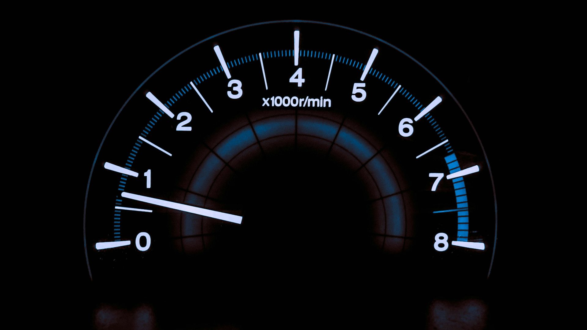 white and blue analog tachometer gauge