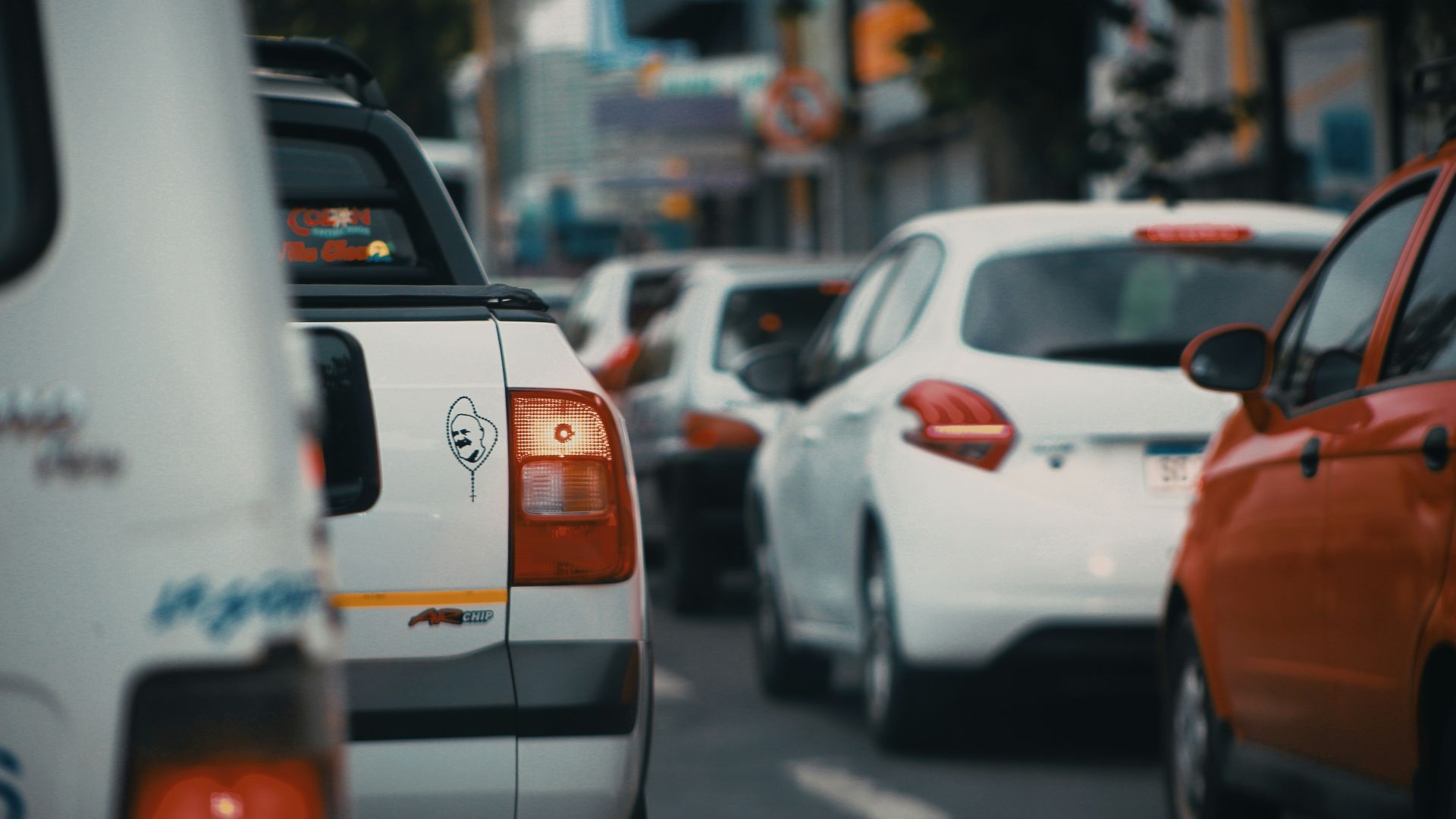 white and orange car on road during daytime