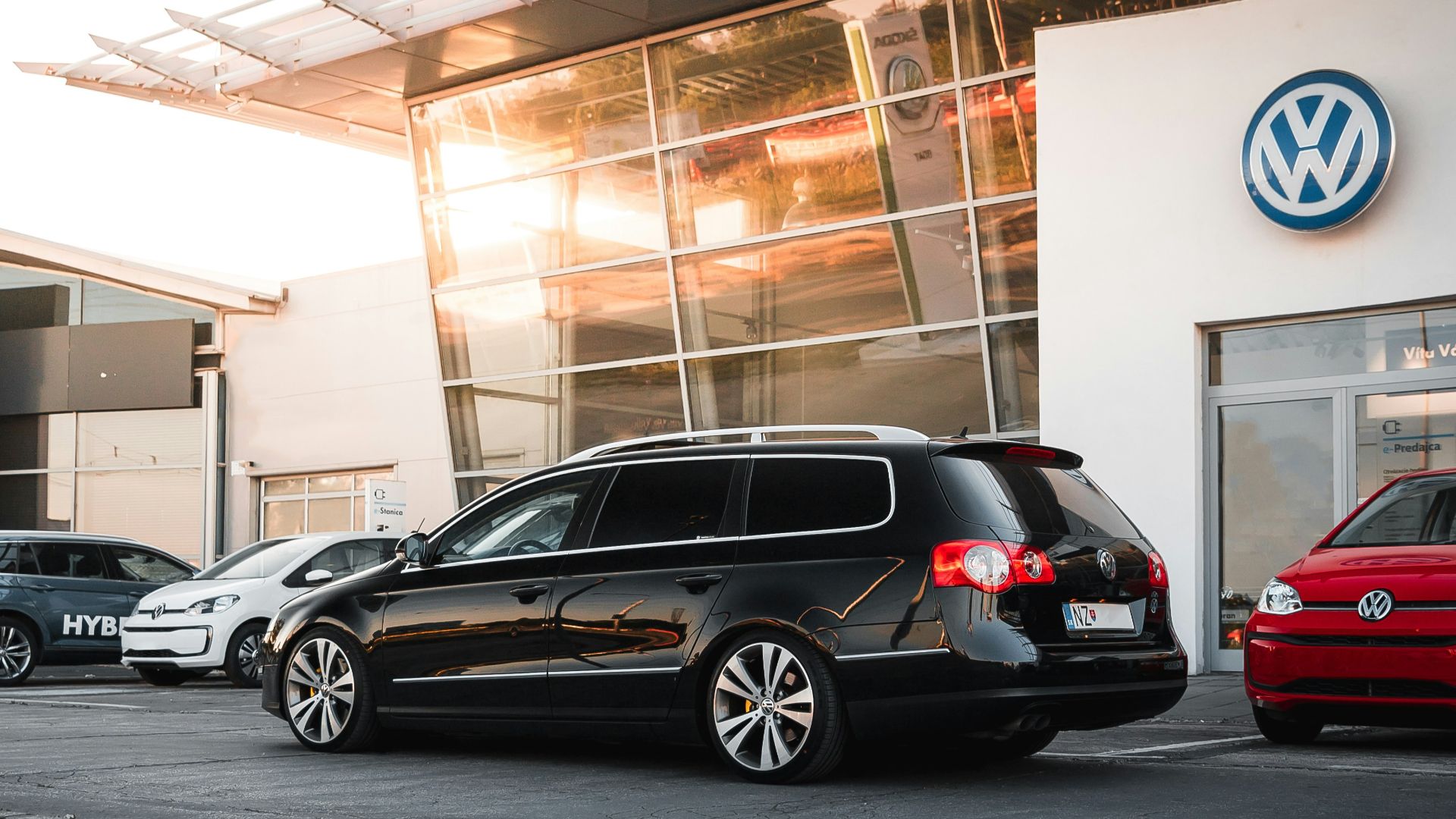 black sedan parked in front of building