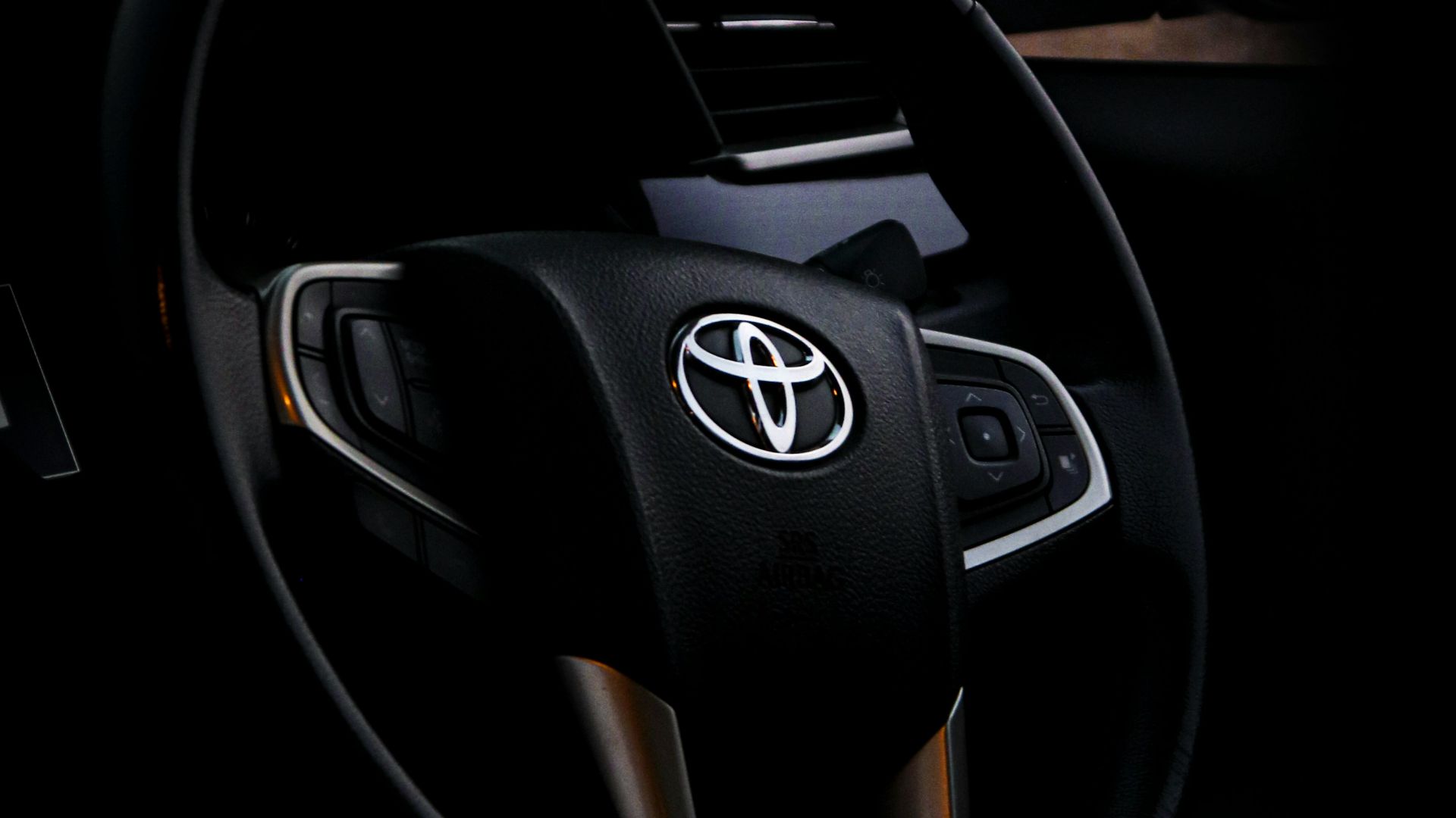 black and silver mercedes benz steering wheel