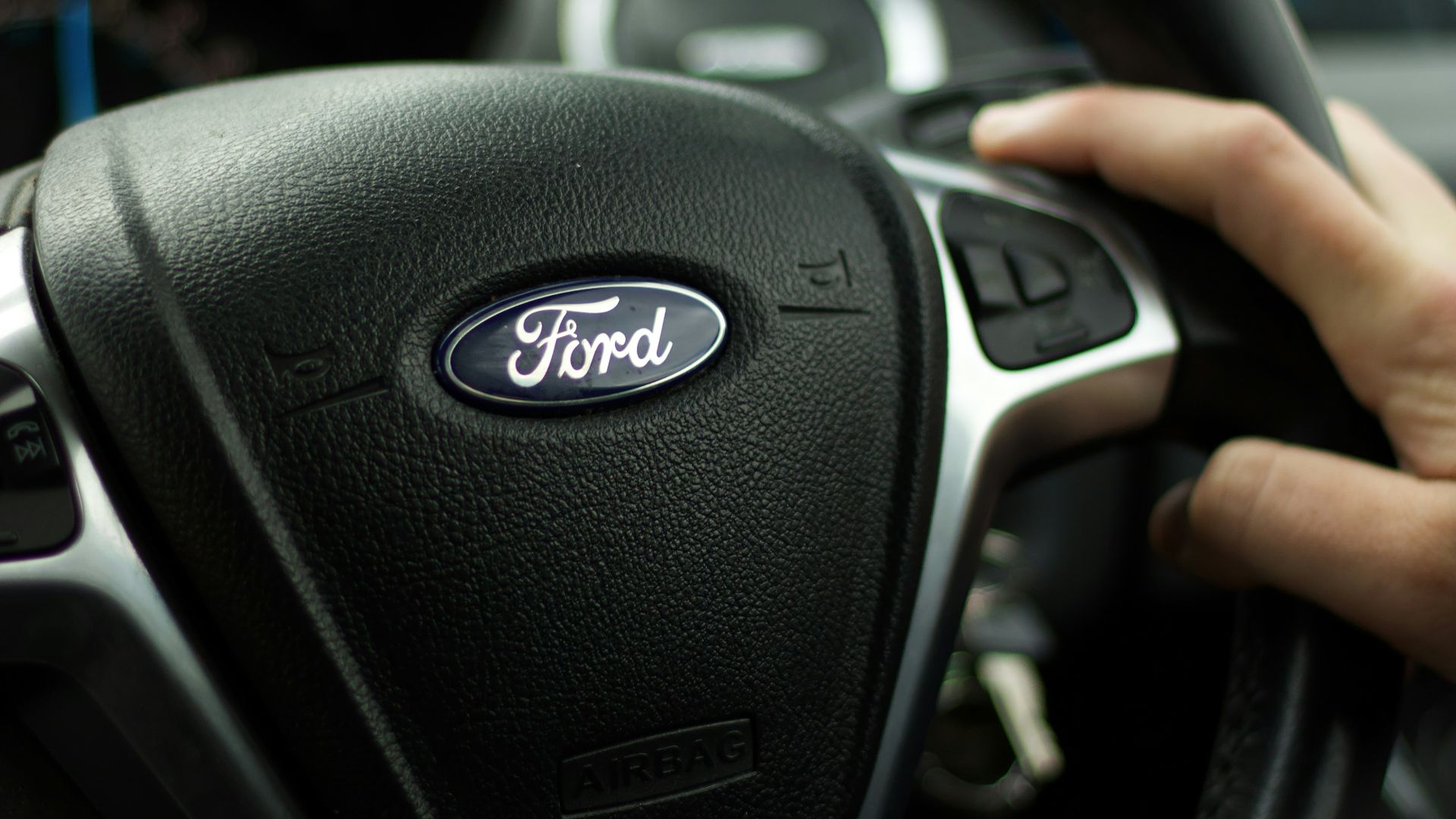 black nissan car steering wheel