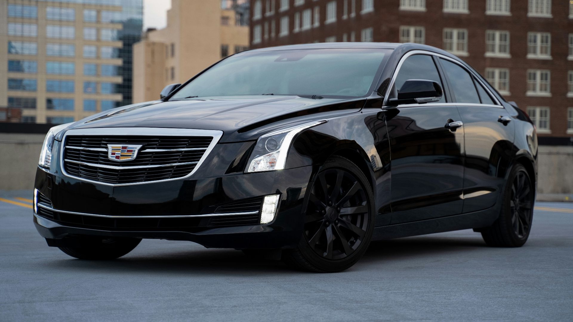 black mercedes benz c class parked on road during daytime