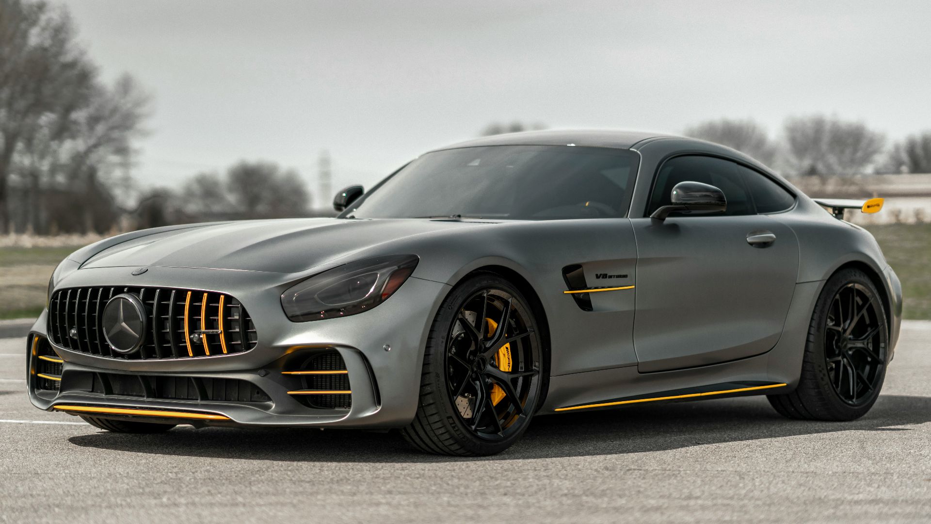 black mercedes benz coupe on gray asphalt road