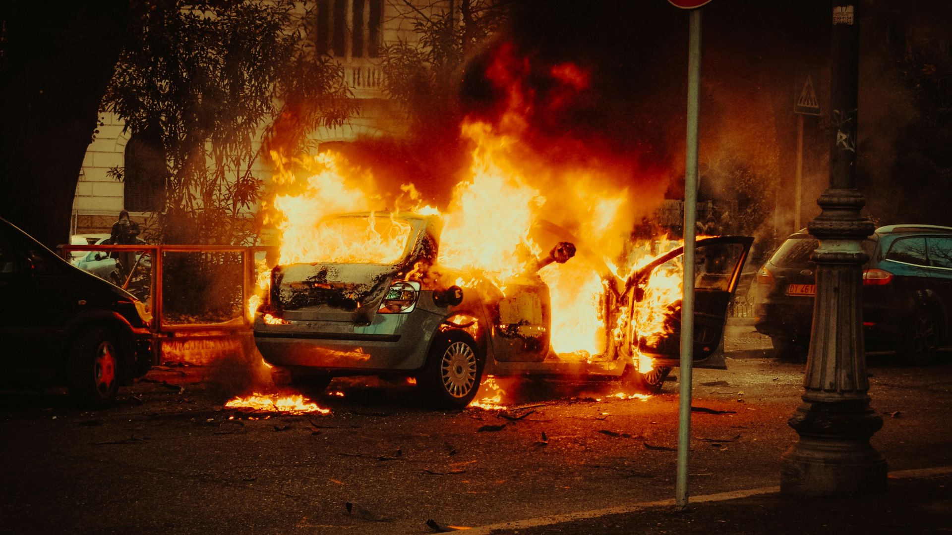 broken car covered with flame