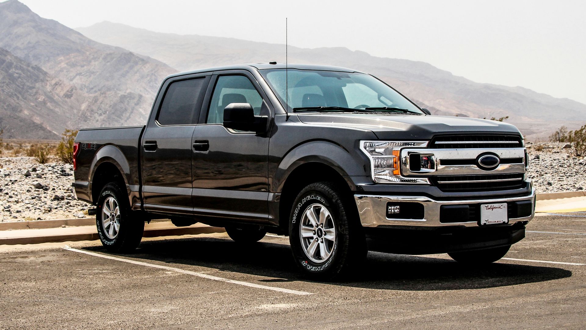 parked black crew-can pickup truck