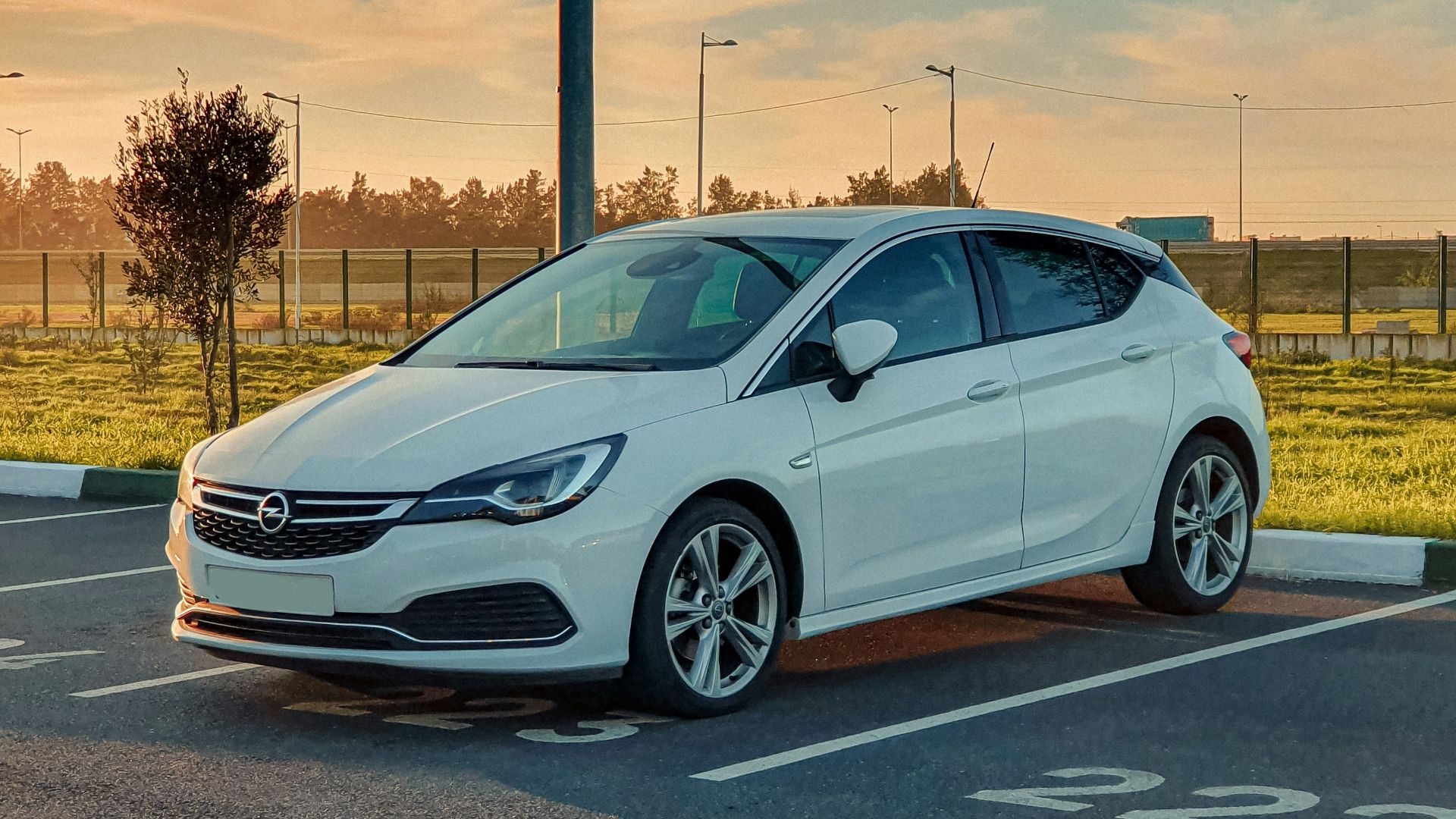 white honda sedan on road during daytime