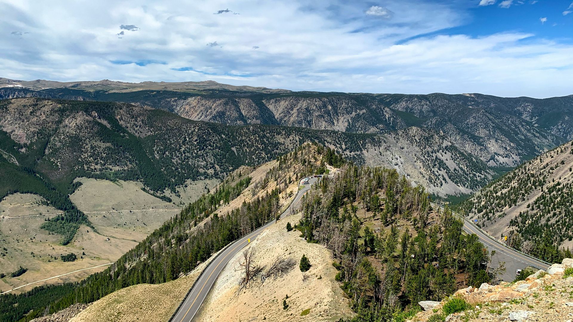 green trees on mountain under blue sky during daytime