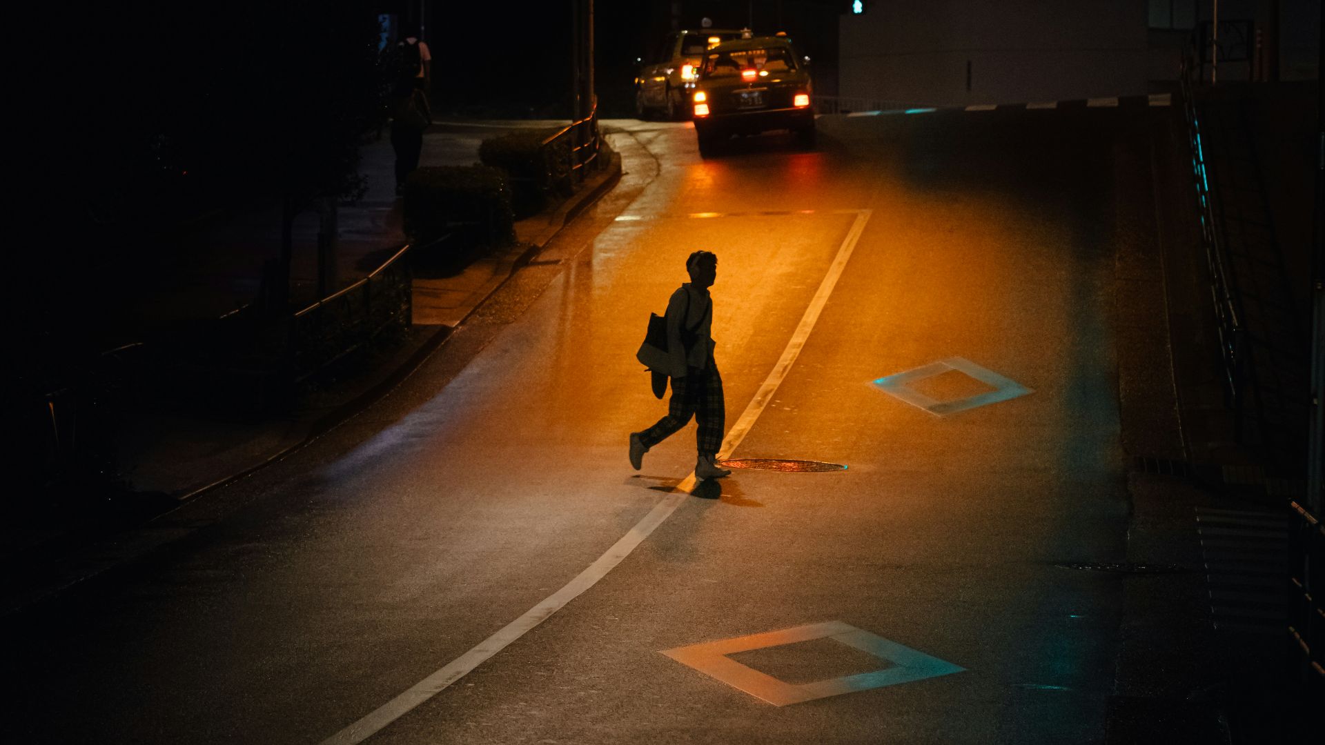 person walking on road