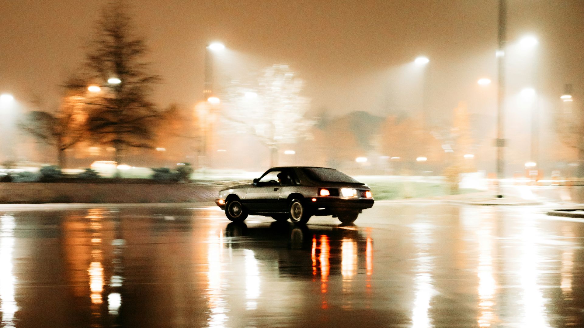 black sedan on road during night time