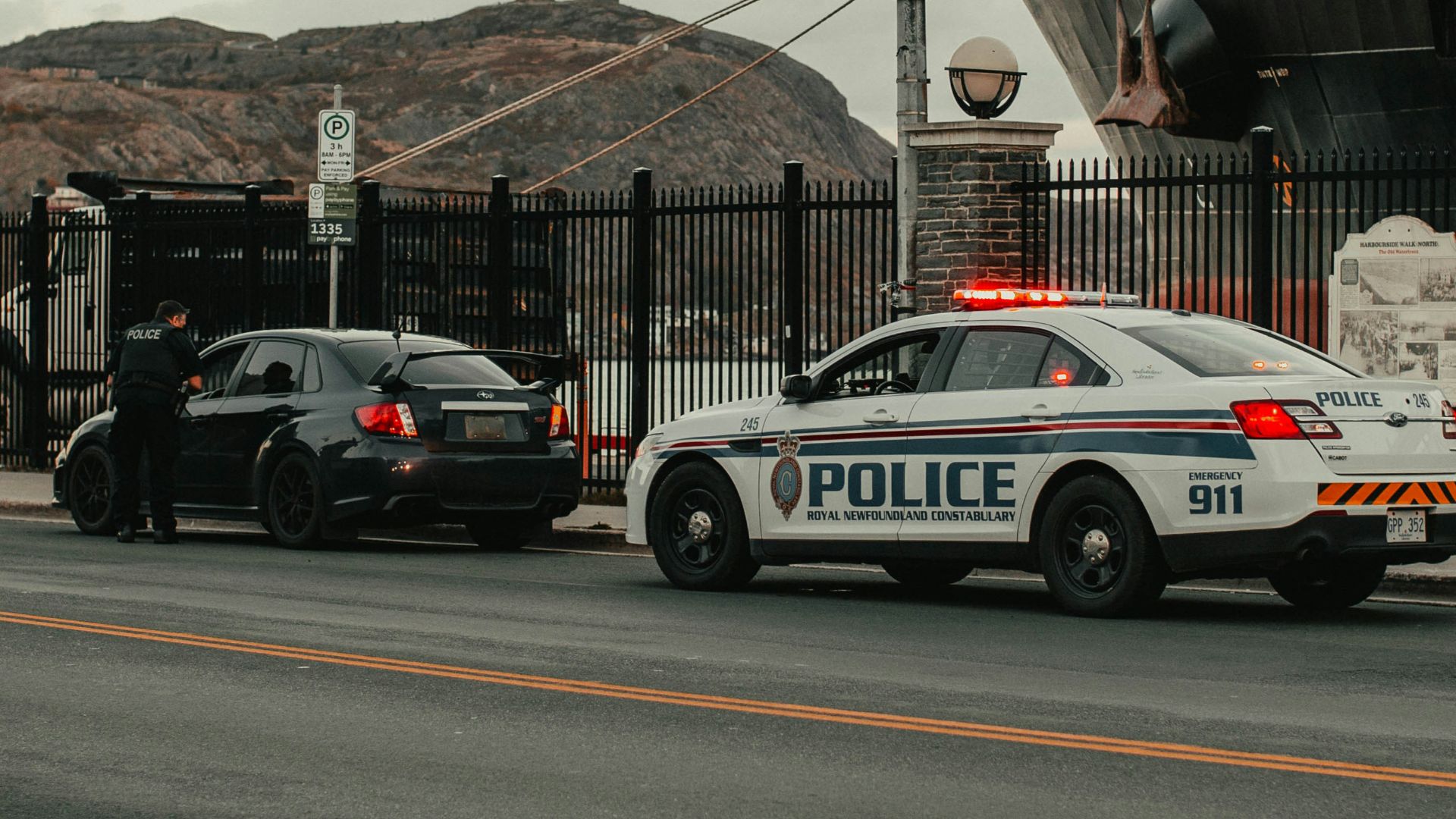 white and blue police car on road