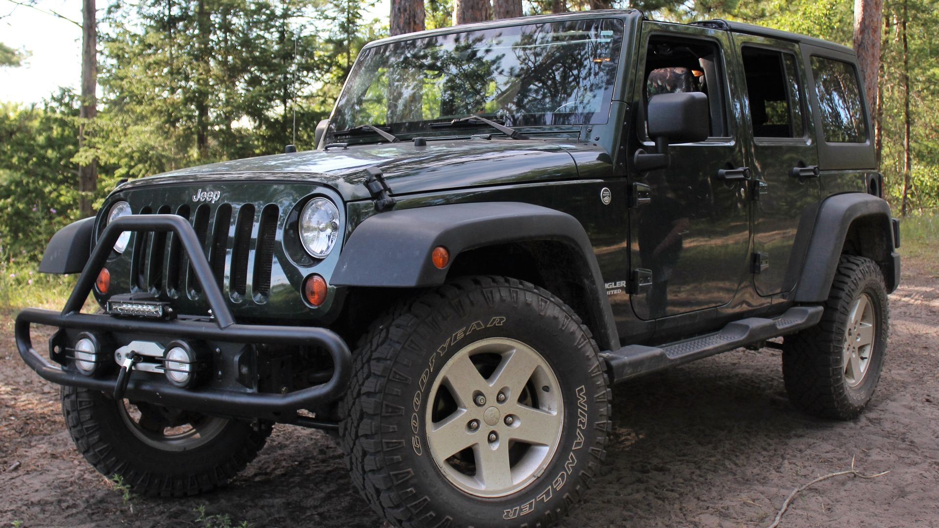 File:2011 jeep wrangler propped on wood stacks.jpg