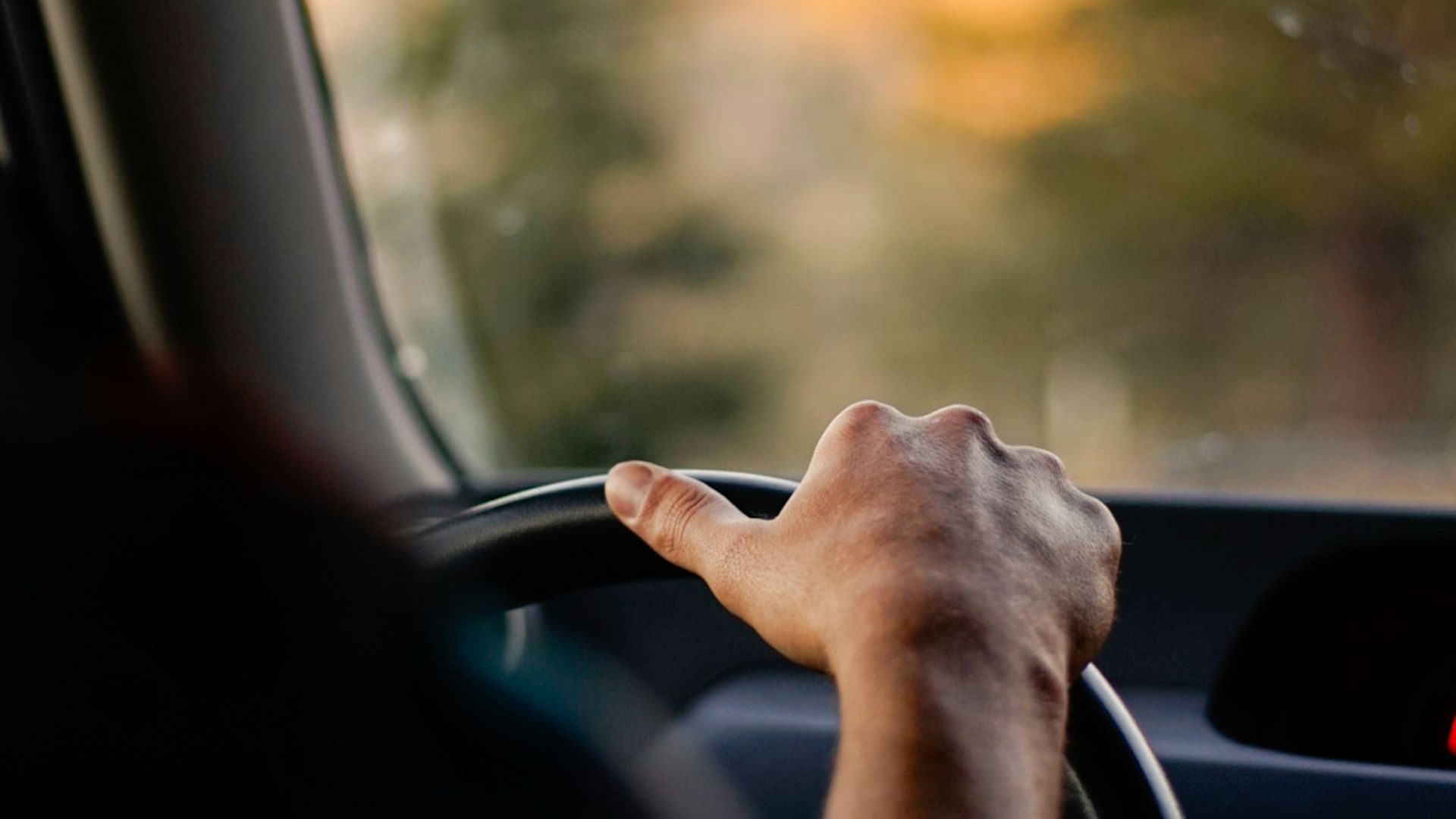 person driving car during daytime