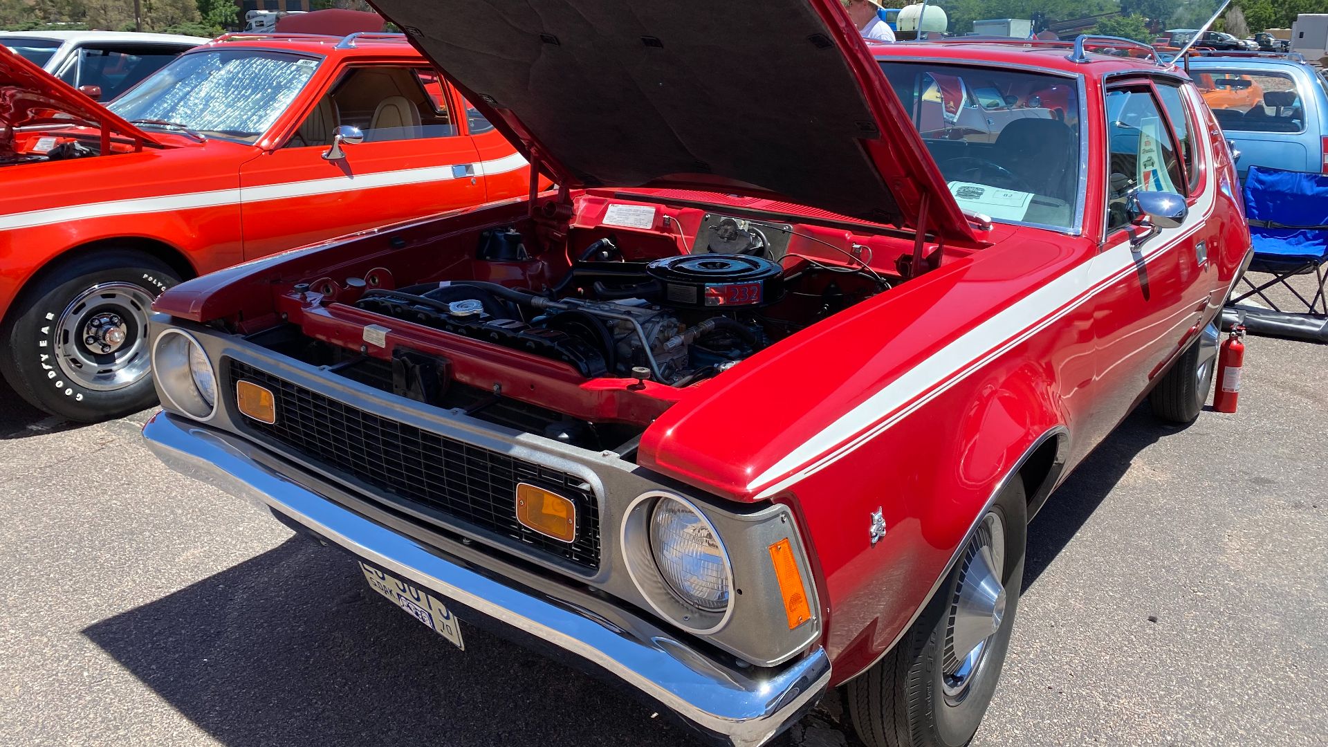 File:1970 AMC Gremlin all original finished in red with white stripe 232 auto AC at 2021 AMO meet 01of15.jpg