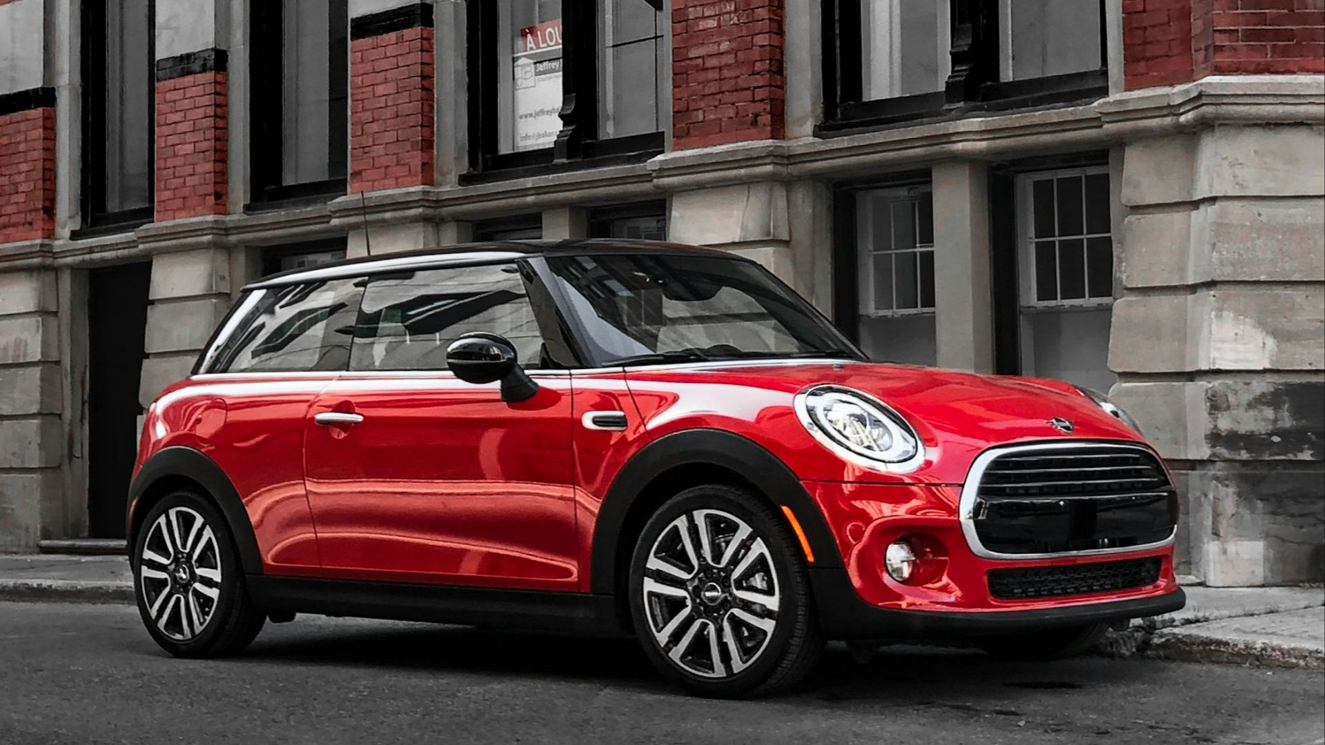 red vehicle near the building