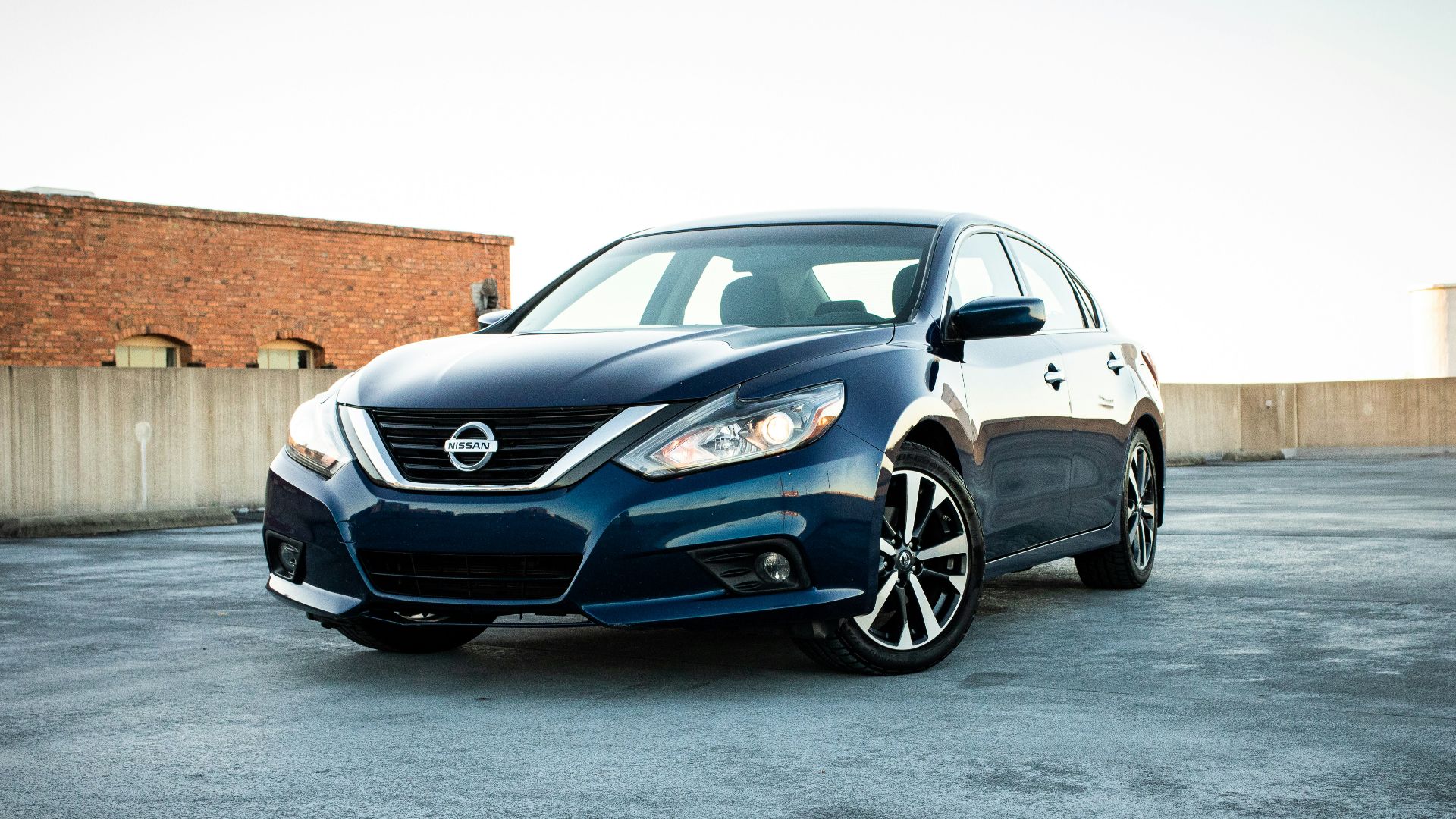 white bmw m 3 coupe parked on gray concrete pavement during daytime