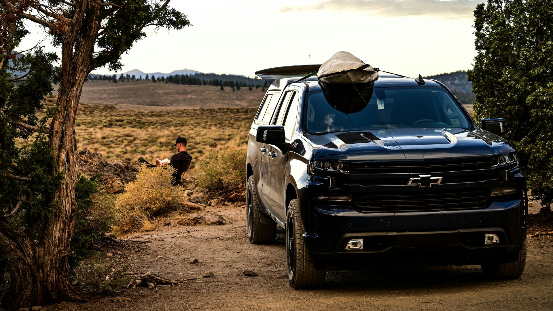 black suv on dirt road during daytime