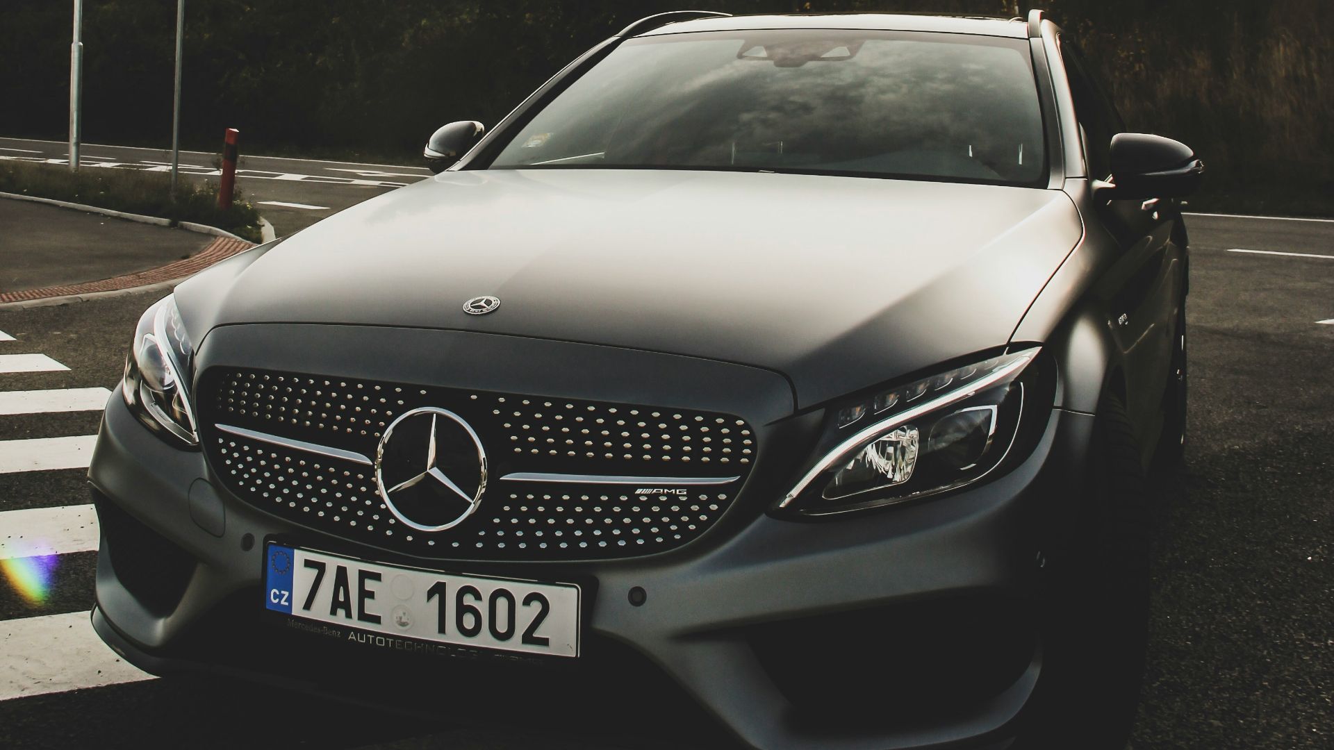 black Mercedes-Benz car on road