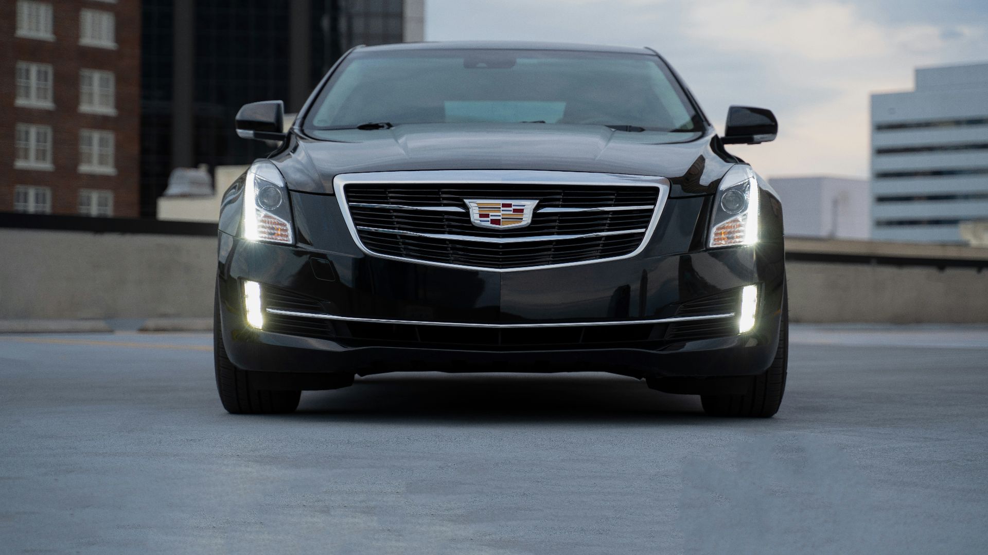 black chevrolet camaro on road during daytime