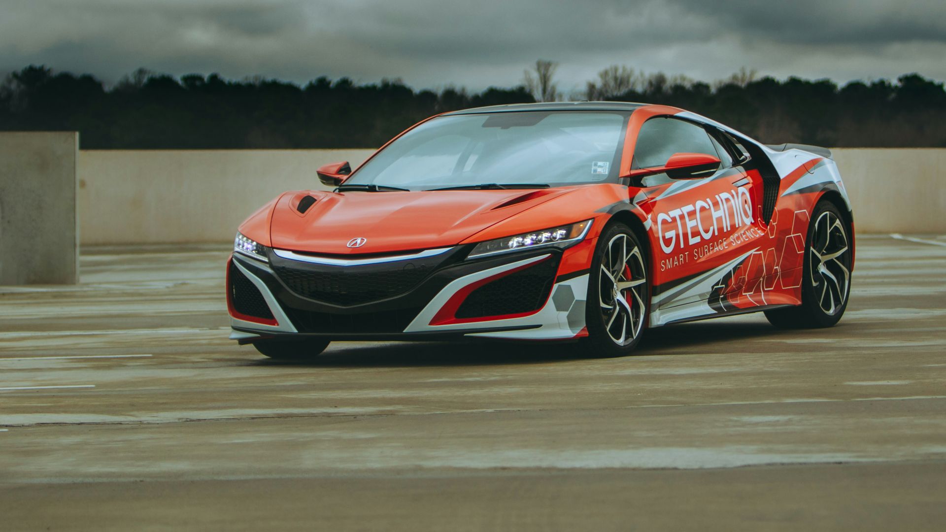 red and white supercar coupe on road