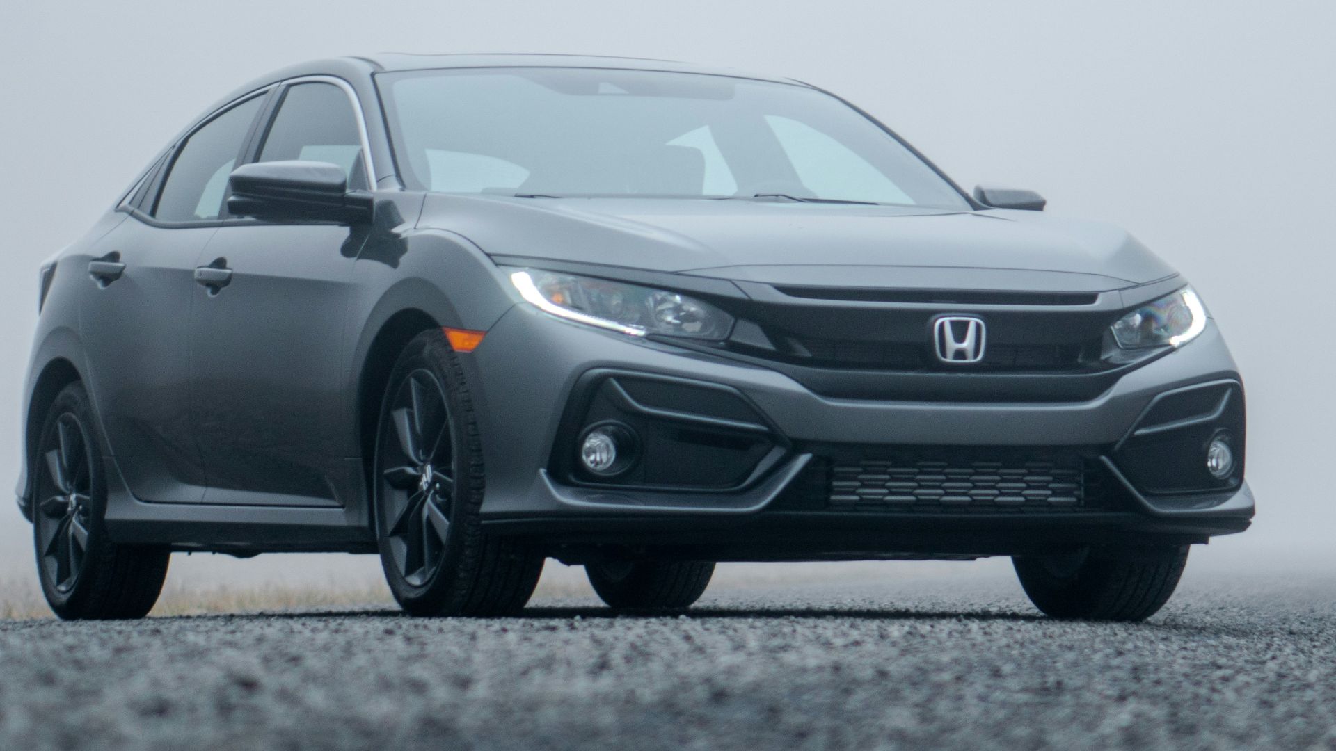 gray Honda sedan parked on road during day
