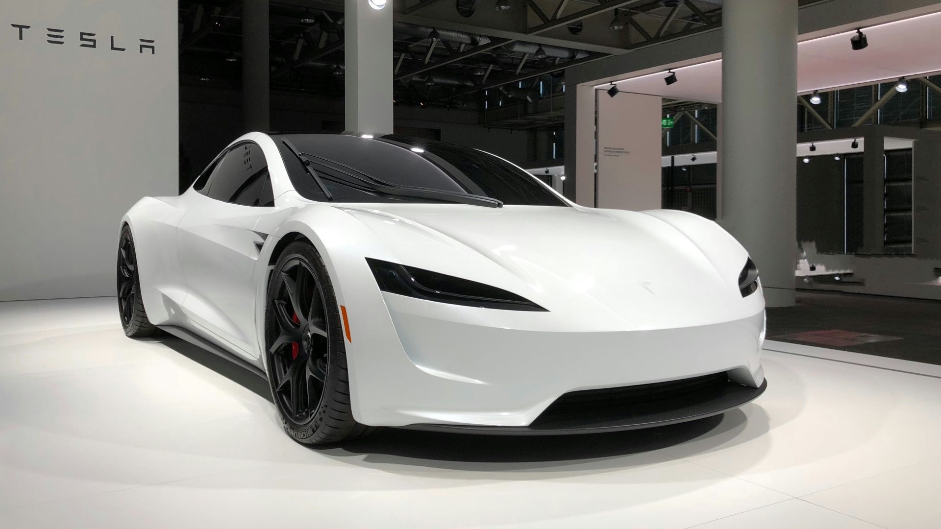 white lamborghini aventador parked in building