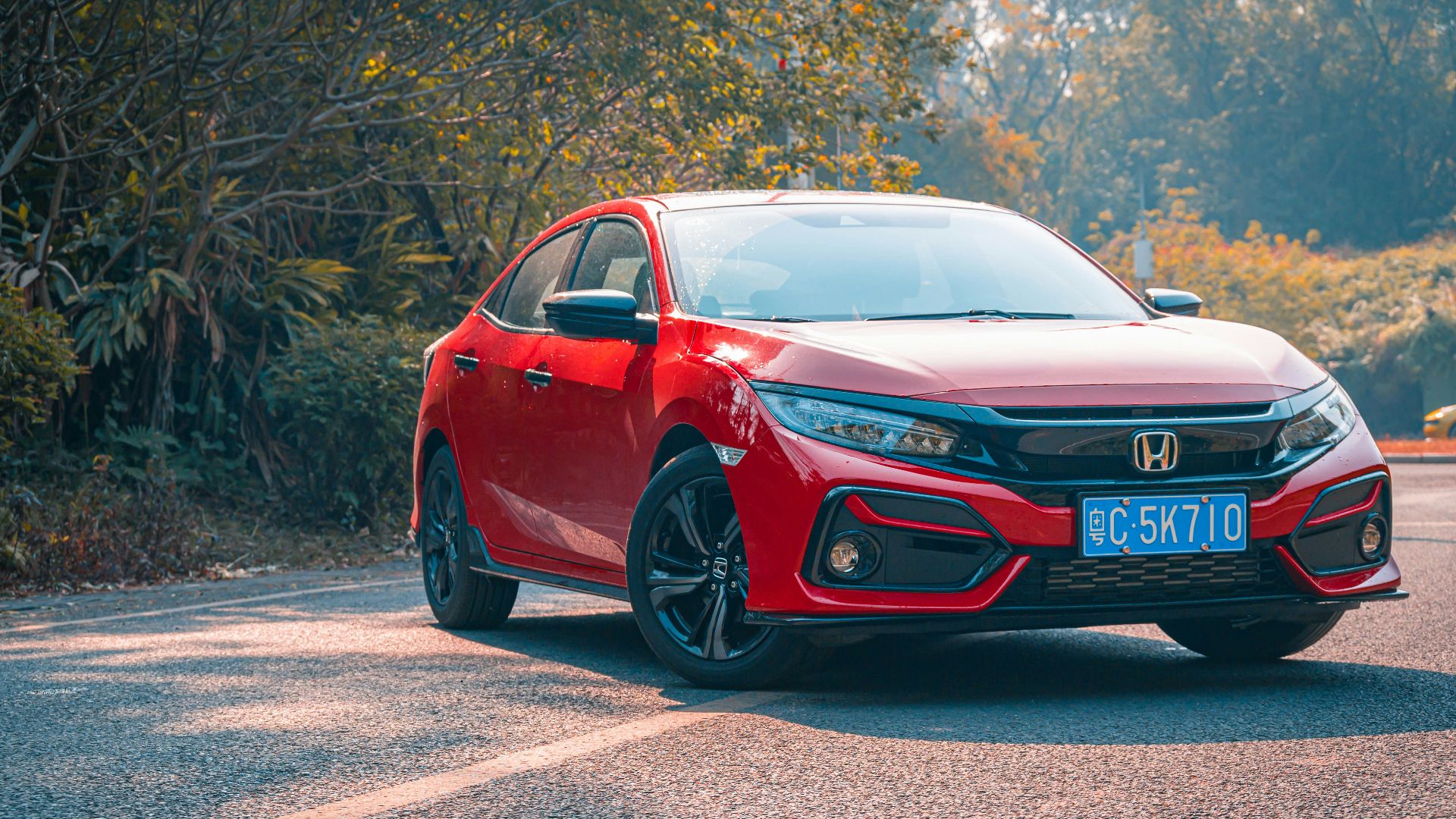 red audi r 8 on road during daytime