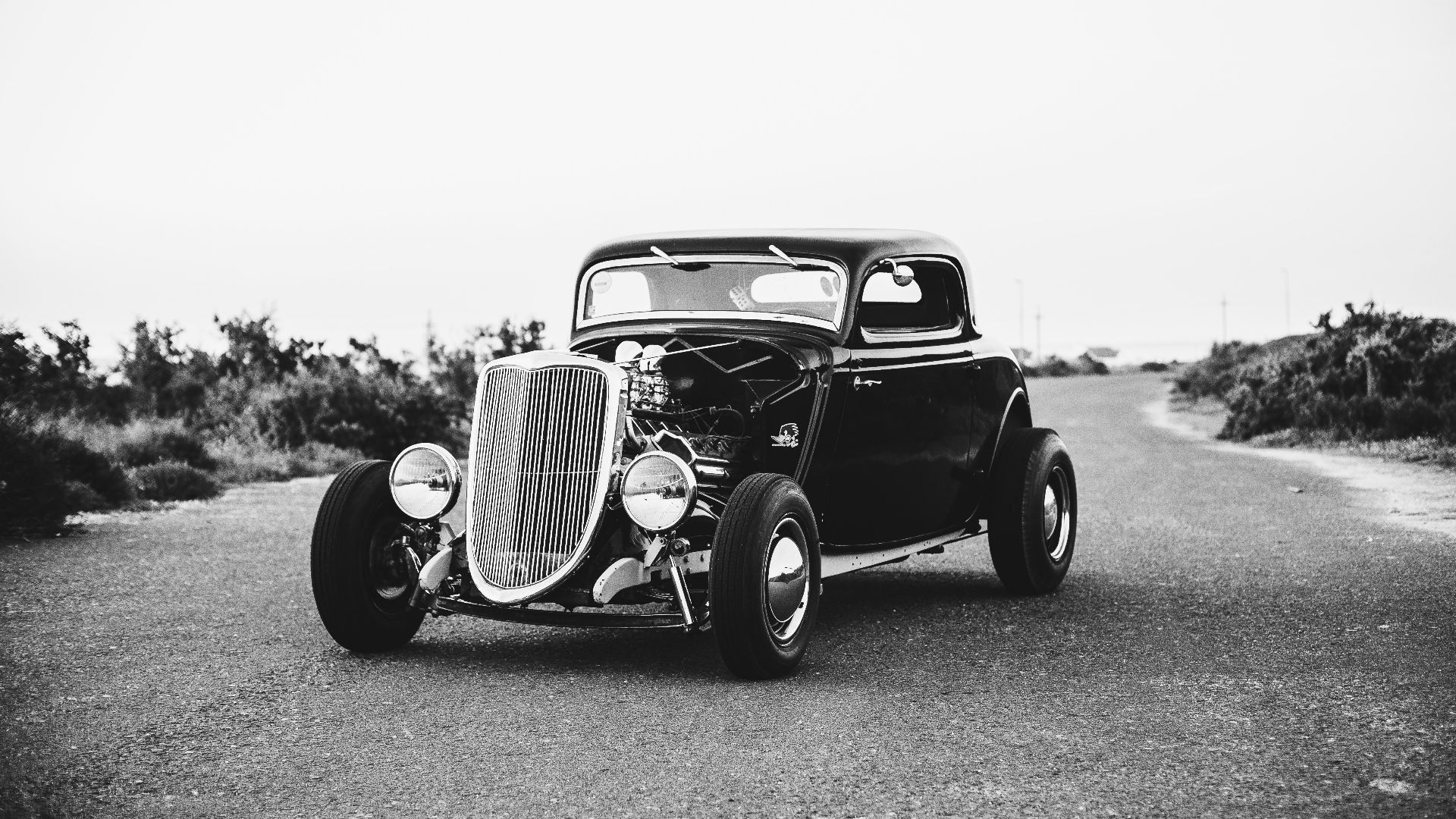 grayscale photography of vintage classic car