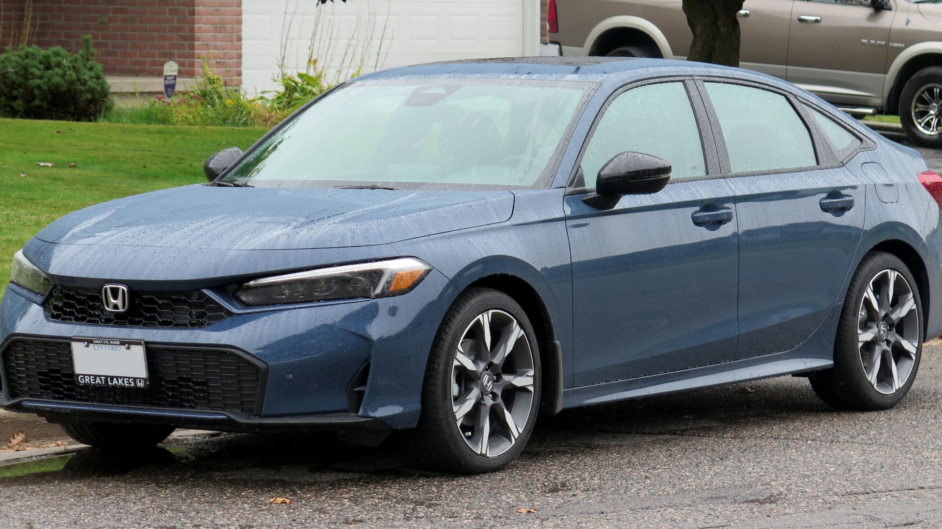 File:2025 Honda Civic Sport Touring Hybrid in Blue Lagoon, front left, 2024-09-24.jpg