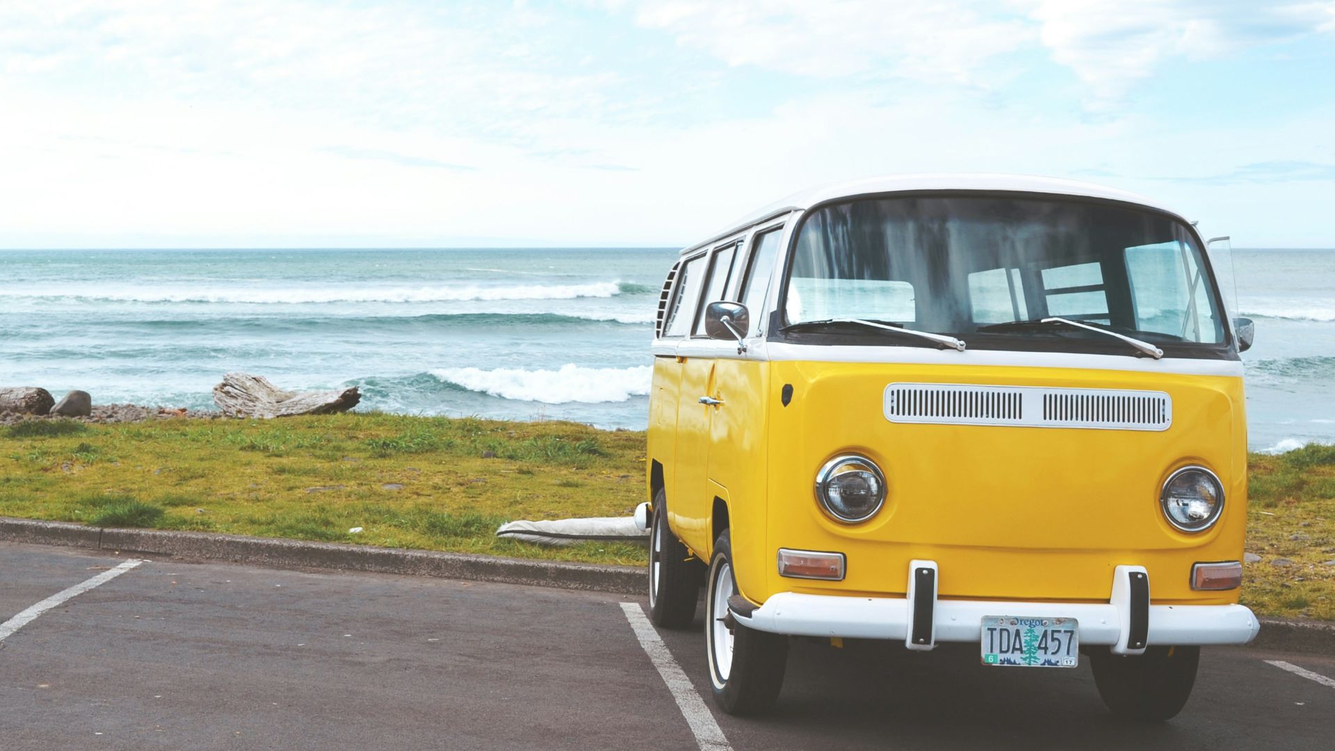 yellow Volkswagen T2 van on concrete road