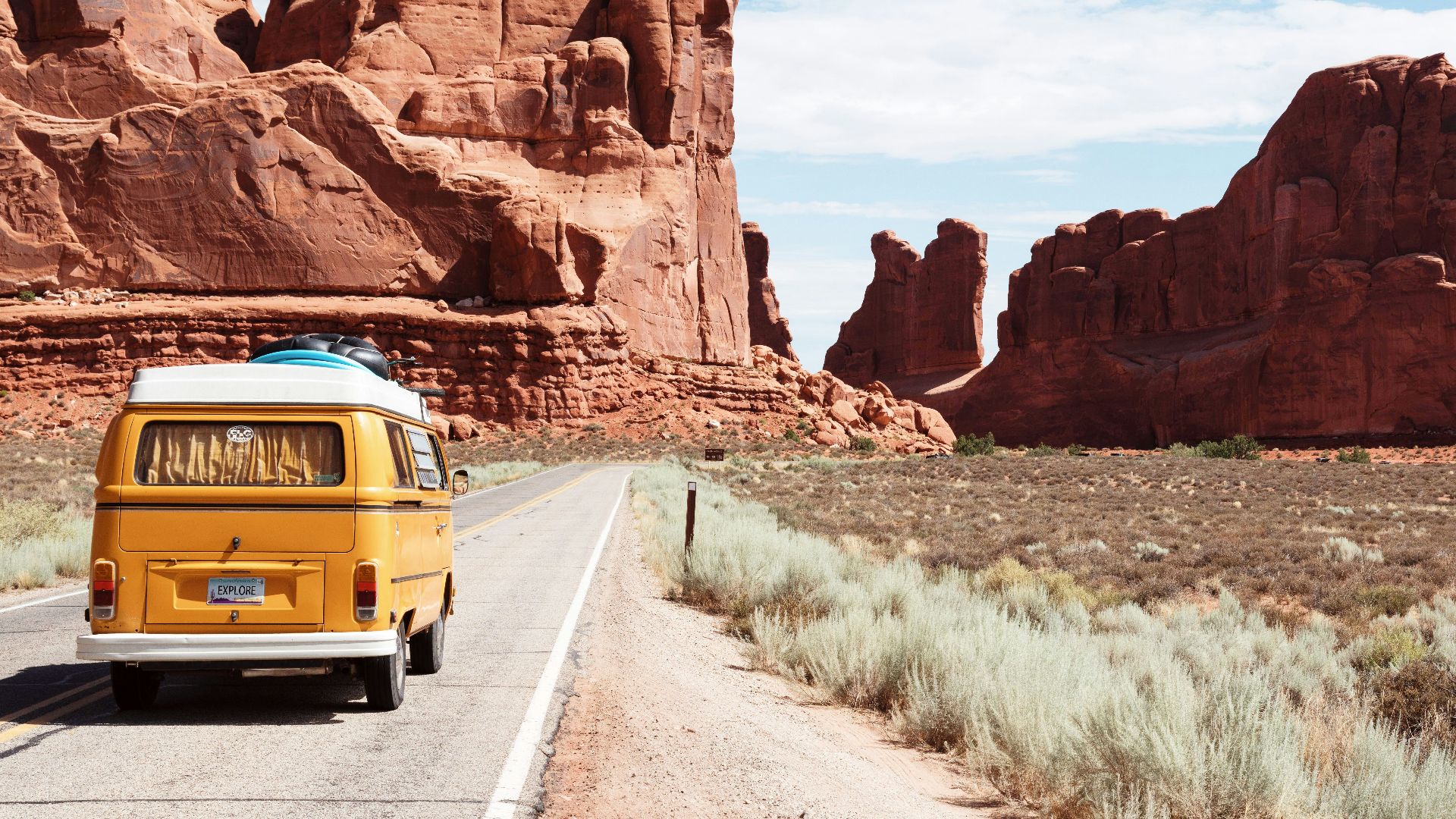 yellow Volkswagen van on road