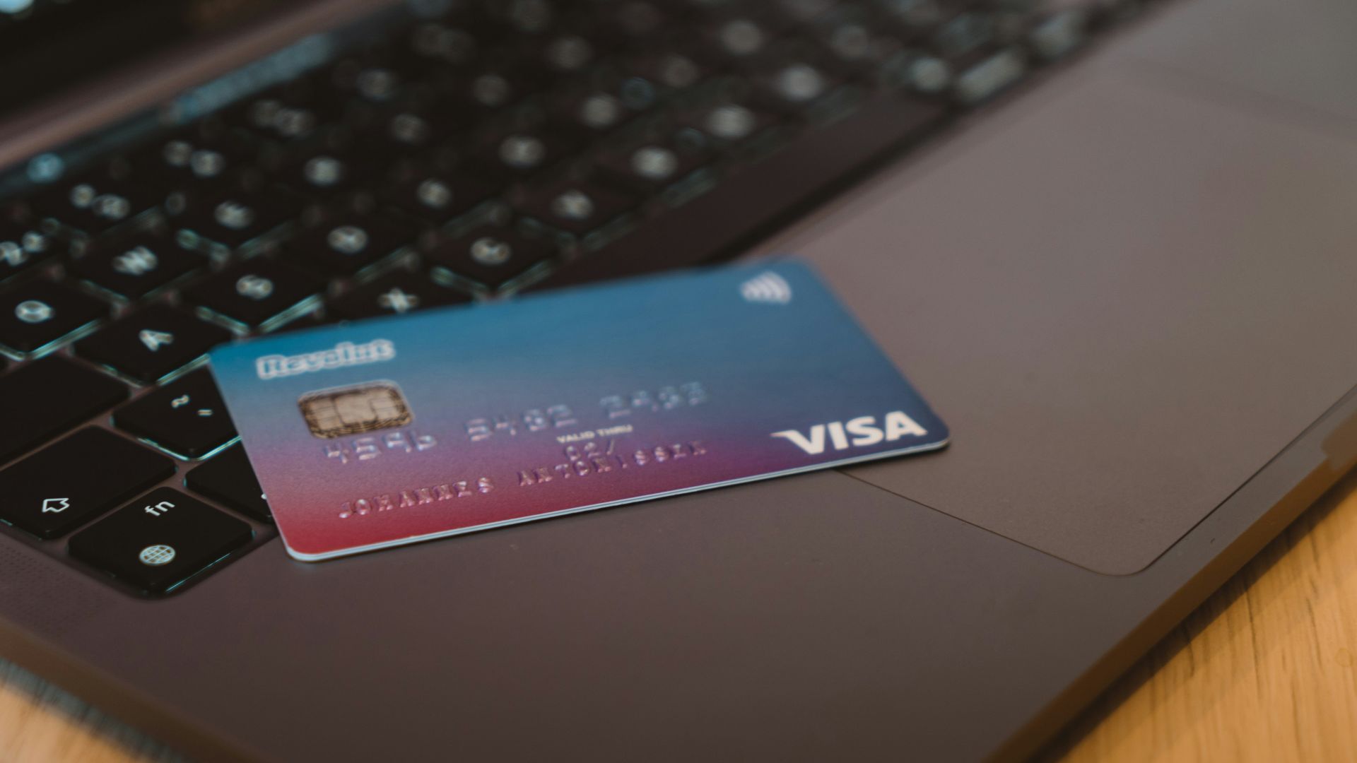 blue and white visa card on silver laptop computer