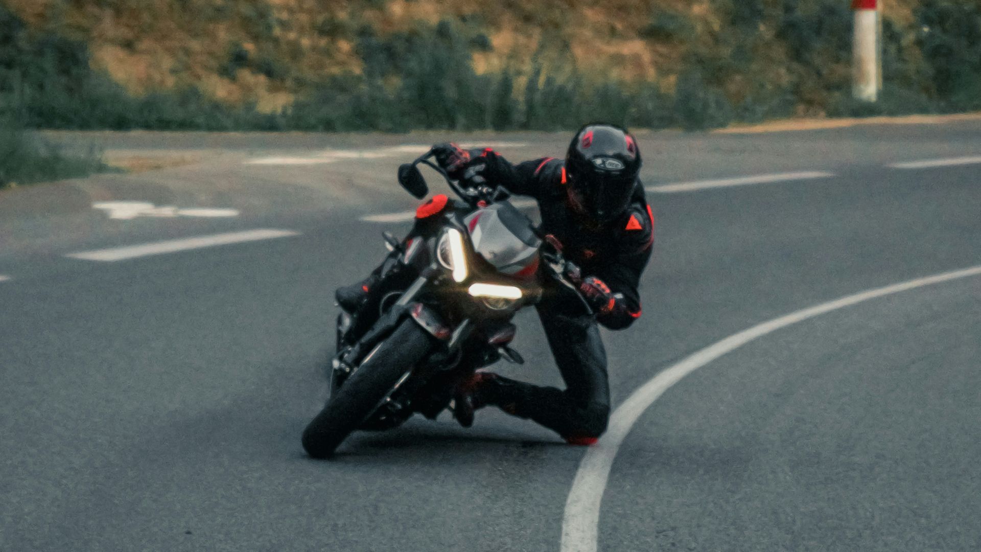 man in black jacket riding motorcycle on road during daytime