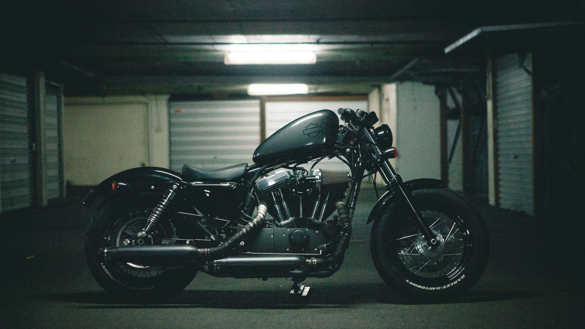 black bobber motorcycle inside garage