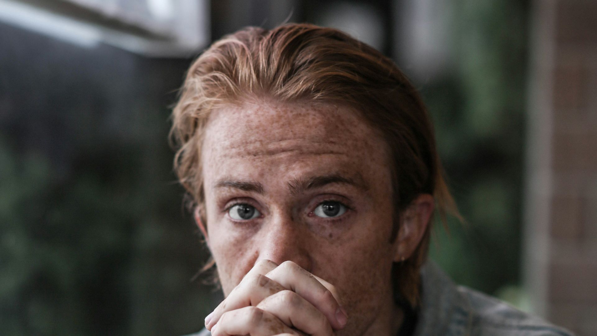 man in gray-washed denim jacket