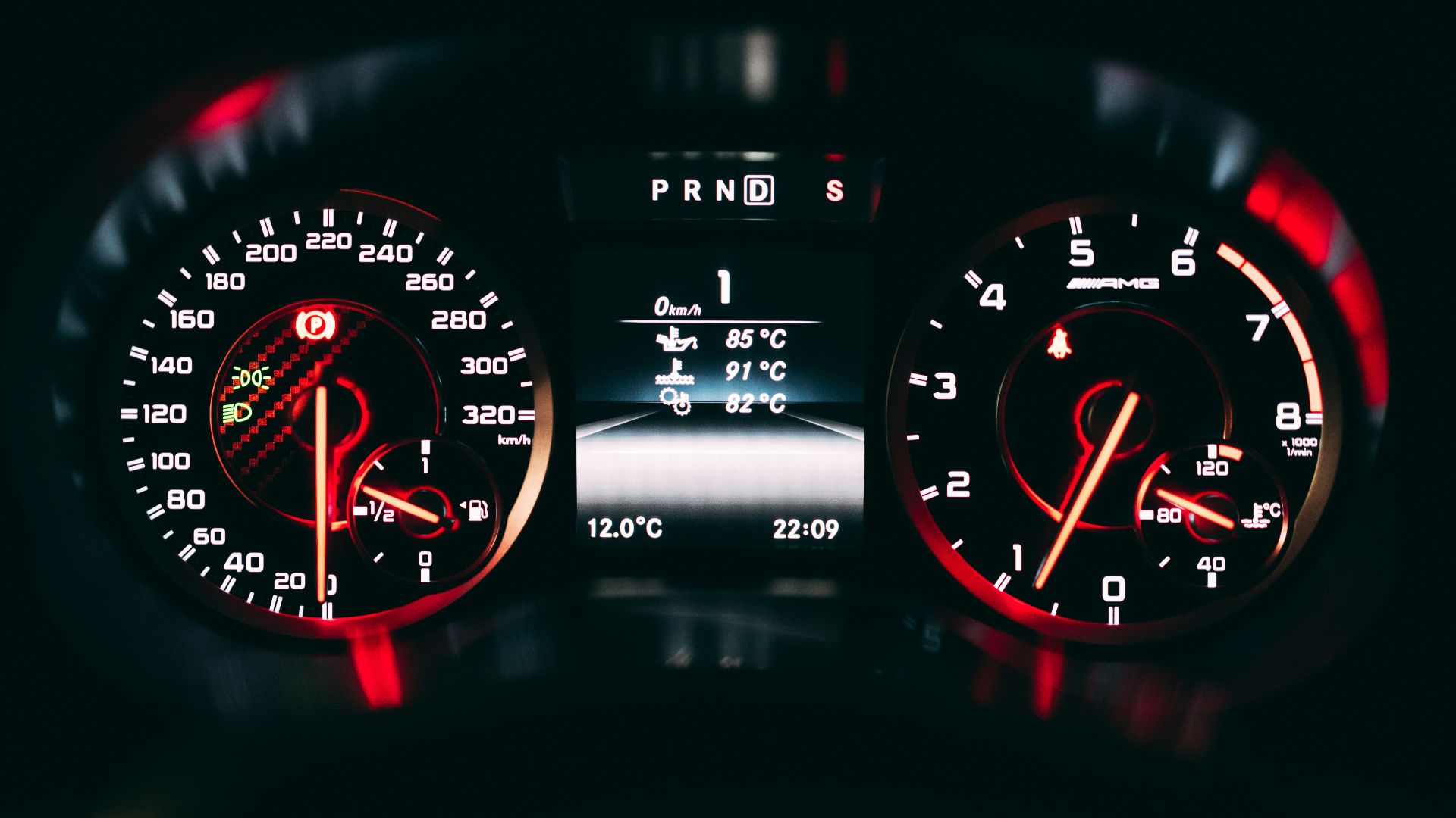 black and red analog speedometer