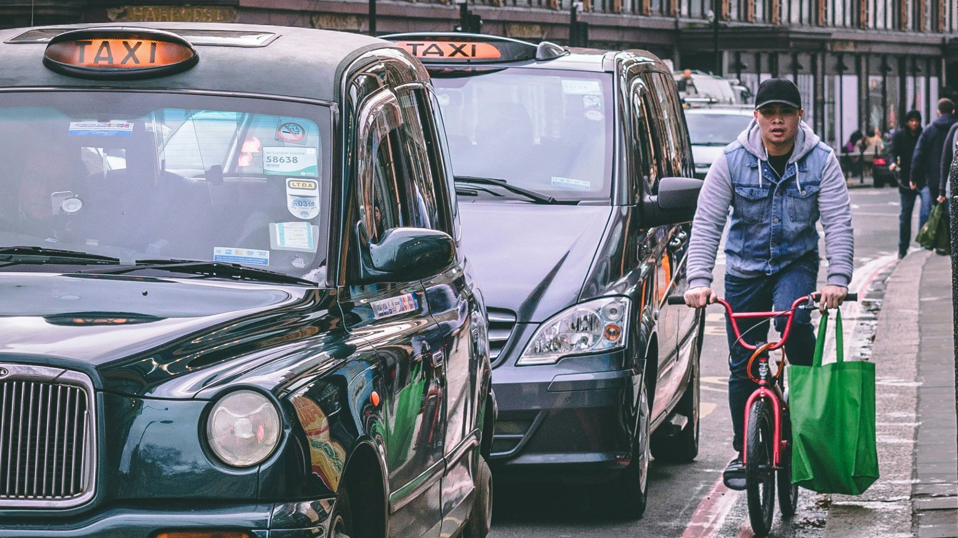 person riding bike on busy road