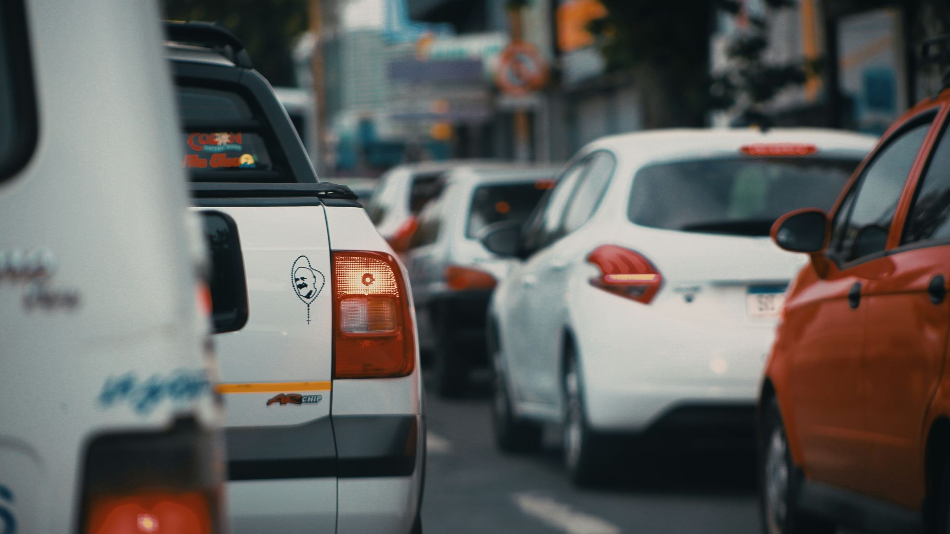 white and orange car on road during daytime