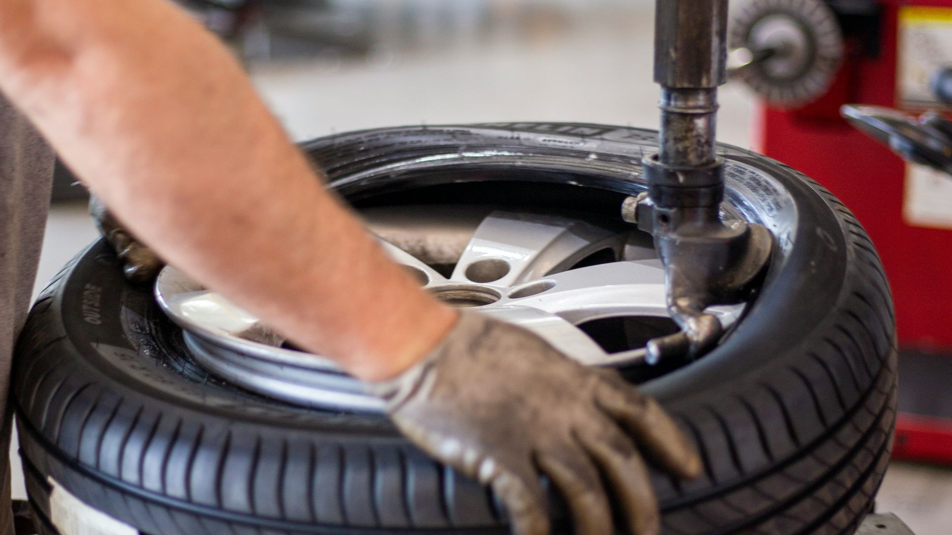 person holding black and gray metal tool
