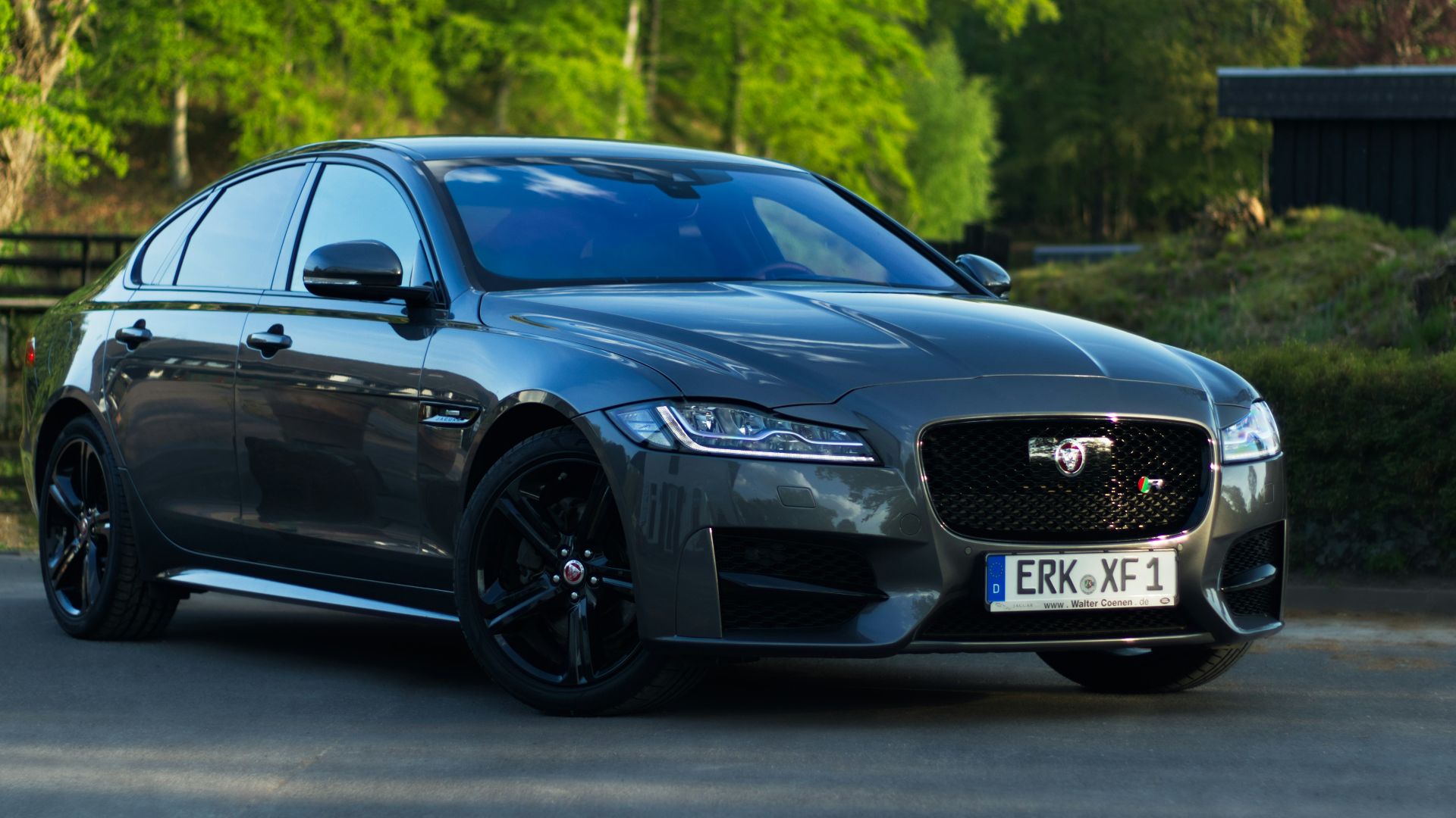 black audi a 4 coupe on road during daytime