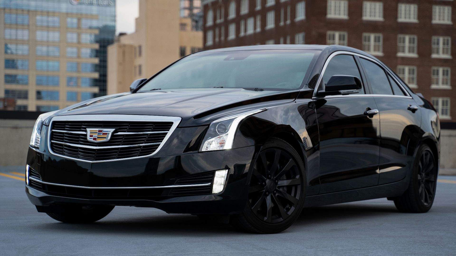 black mercedes benz c class parked on road during daytime