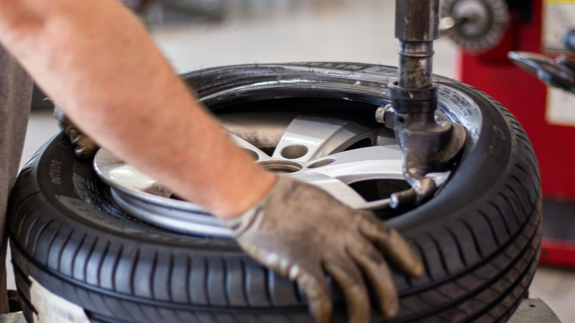 person holding black and gray metal tool