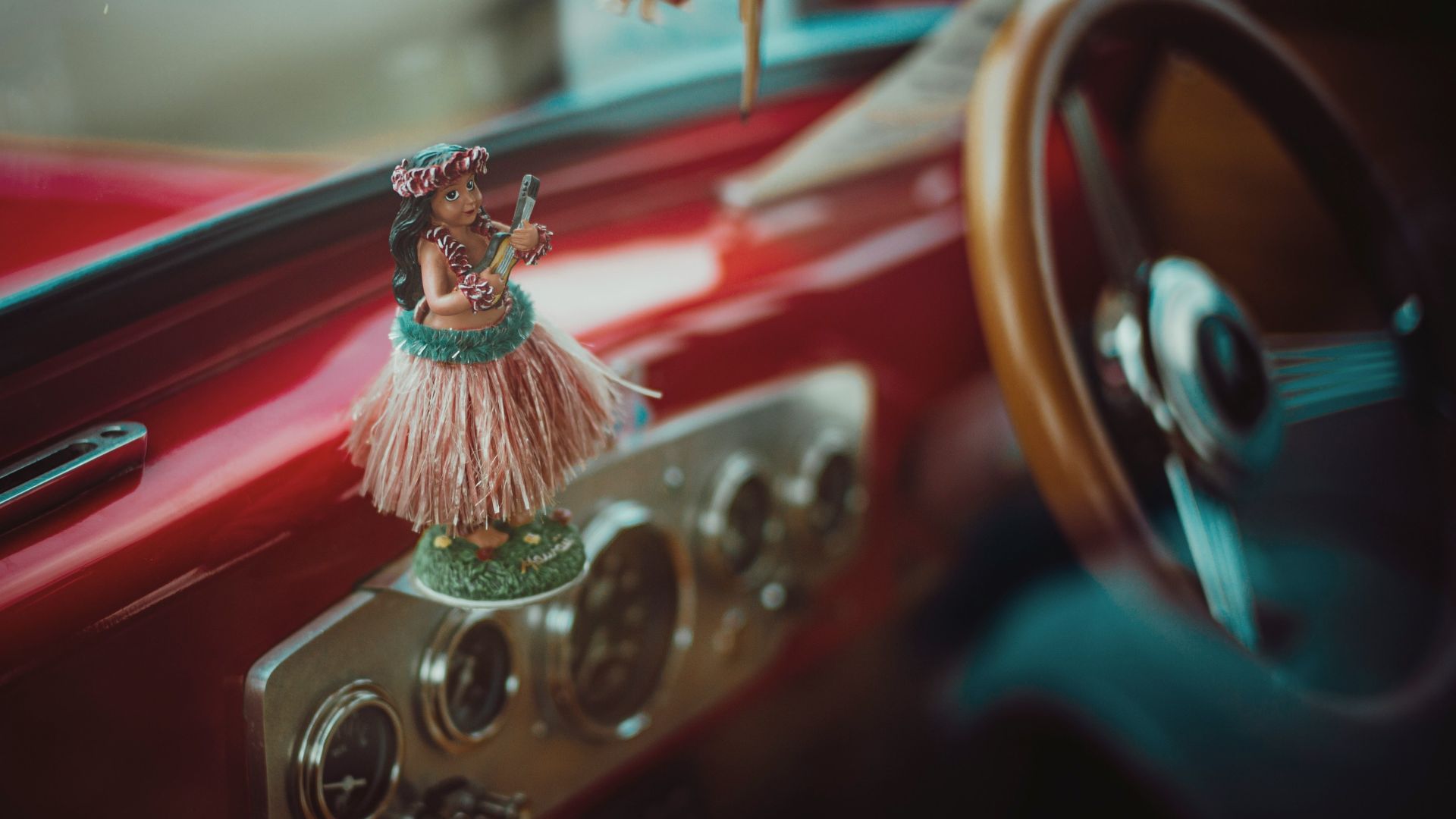 red and gold car steering wheel