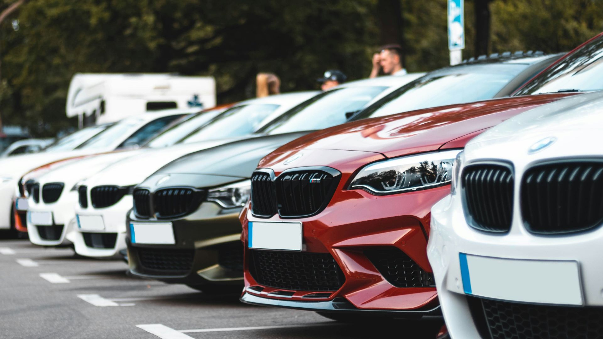 white and red bmw m 3 on road during daytime