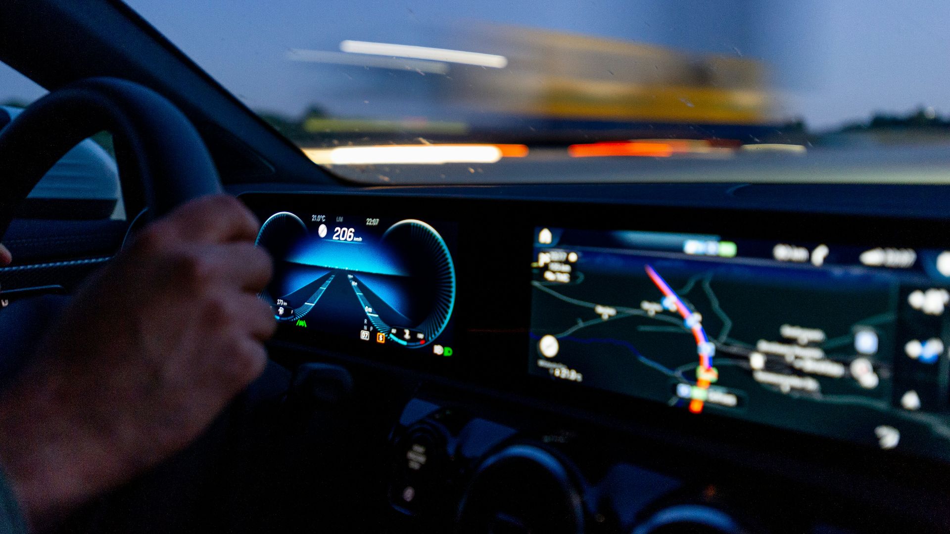 person's hand on steering wheel